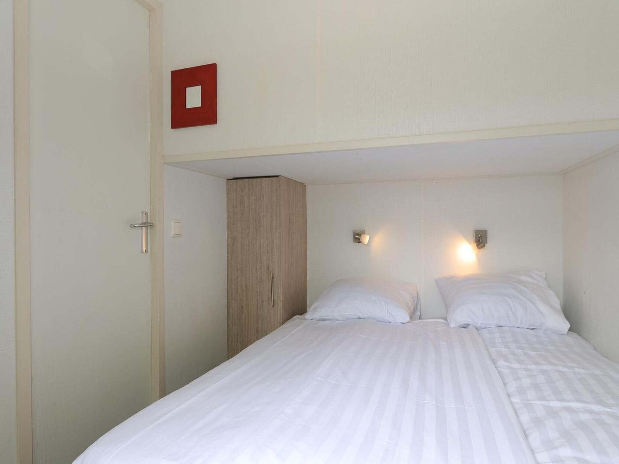 Een slaapkamer van Boslodge 6 in Otterlo