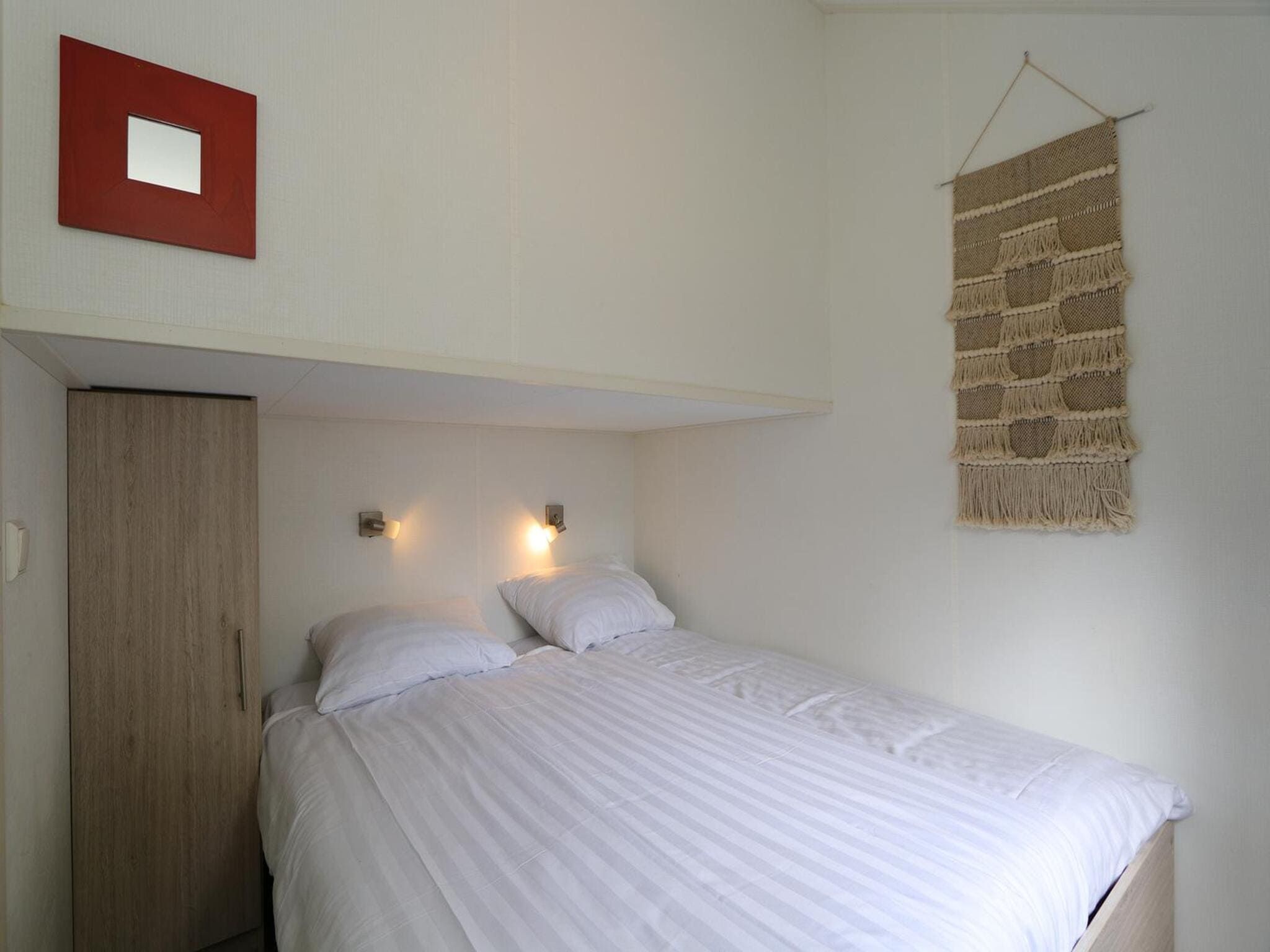 Een slaapkamer van Boslodge 6 in Otterlo