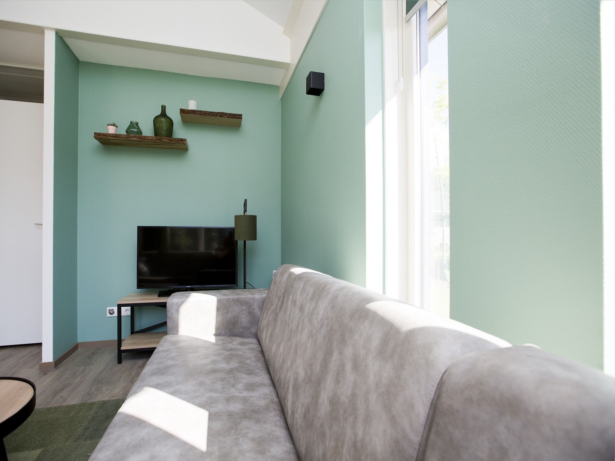 De woonkamer van Landgoed De IJsvogel 7 in Voorthuizen