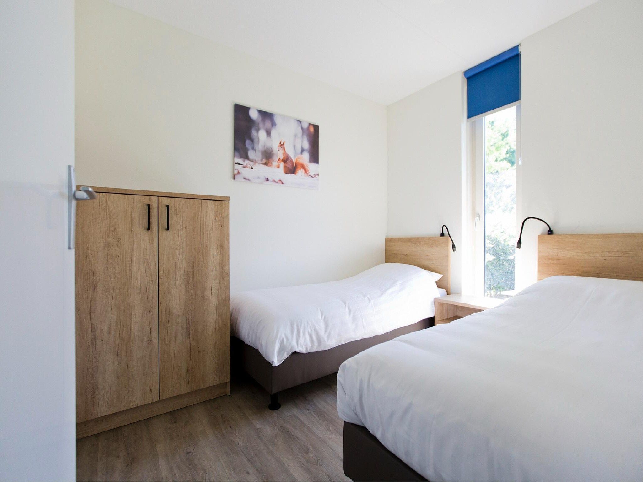 Een slaapkamer van Landgoed De IJsvogel 7 in Voorthuizen