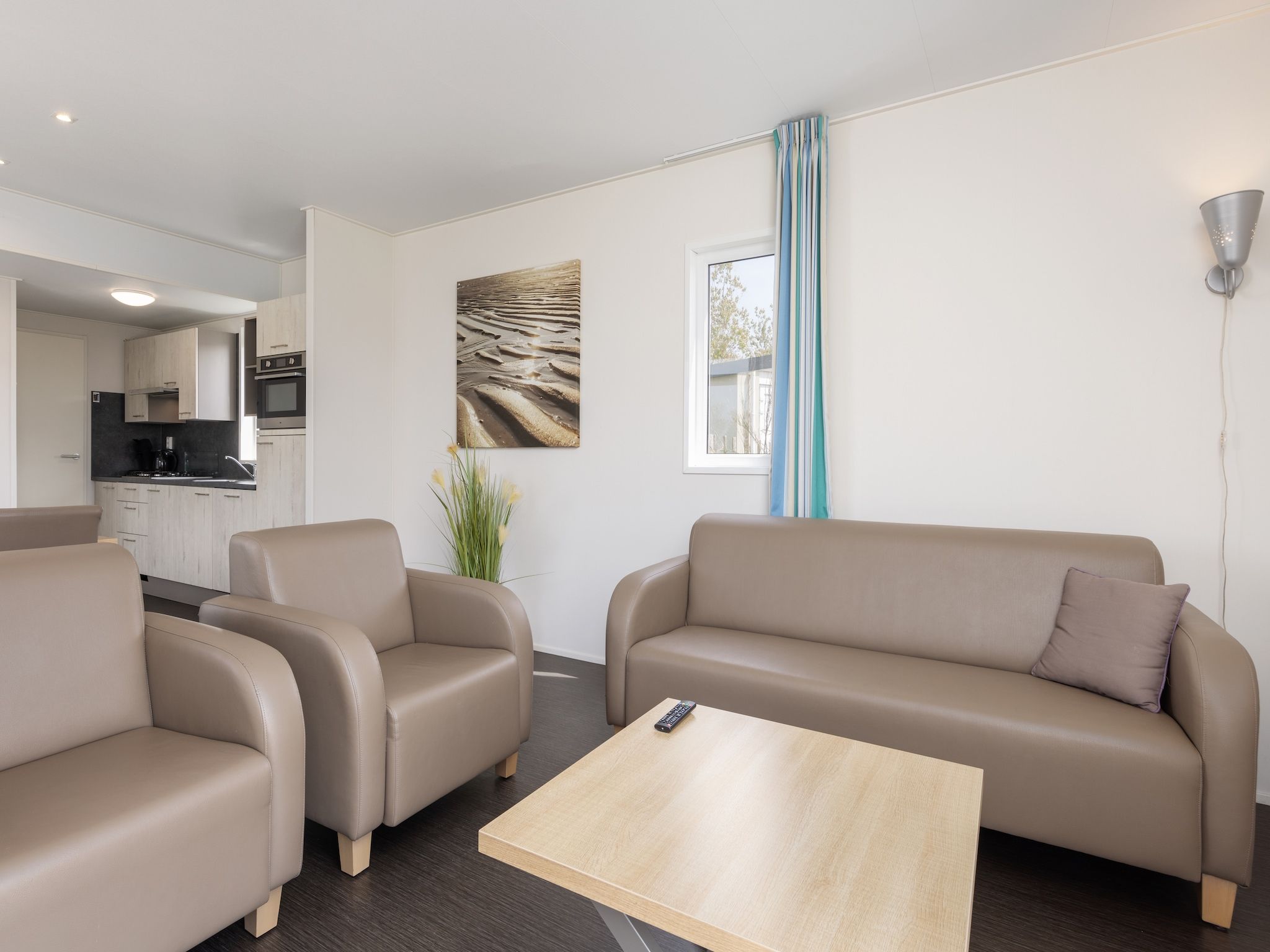 De woonkamer van Vakantiepark Callassande 3 in Callantsoog