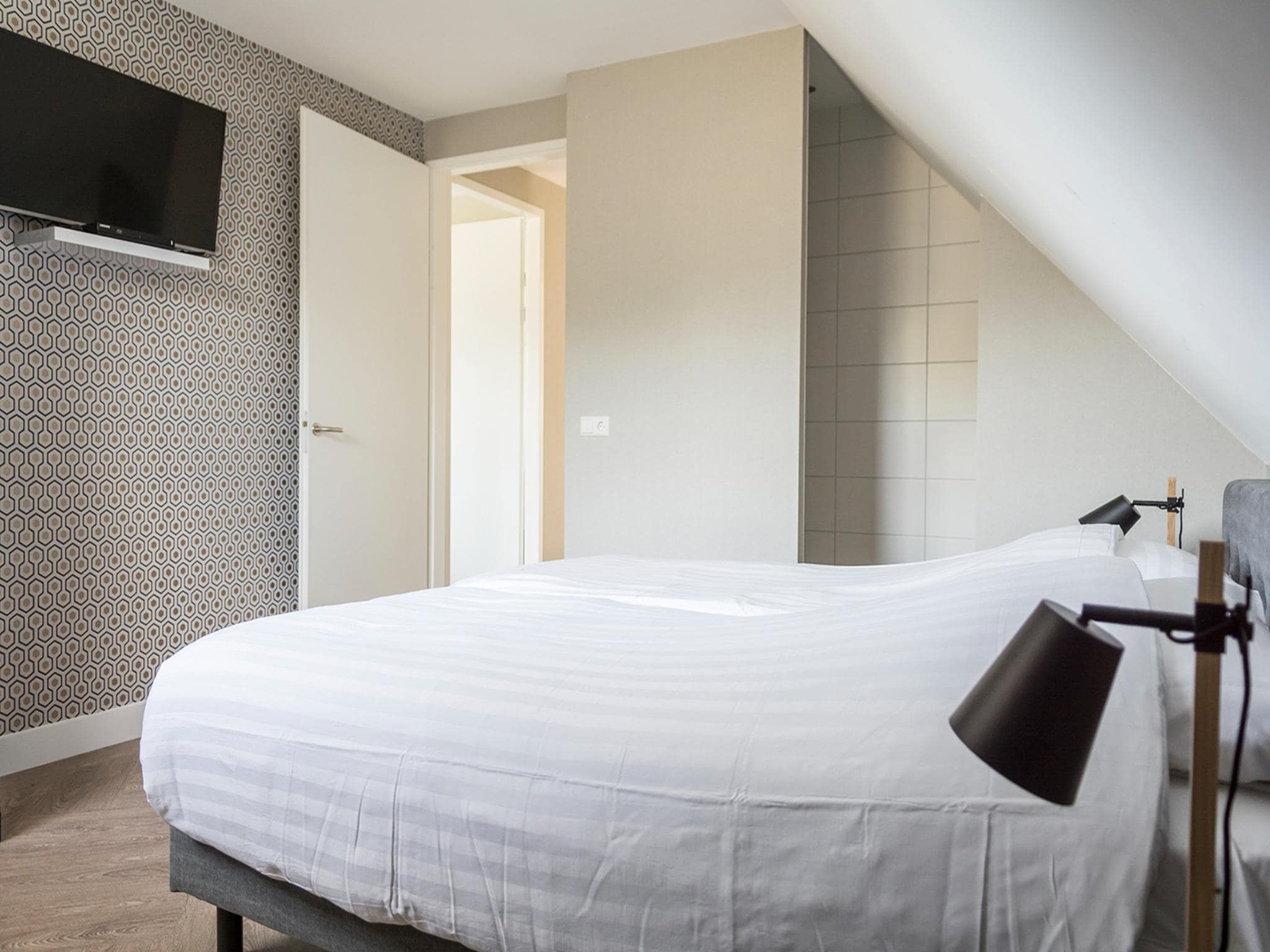 Een slaapkamer van Villa Bouwlust Z in De Cocksdorp Texel