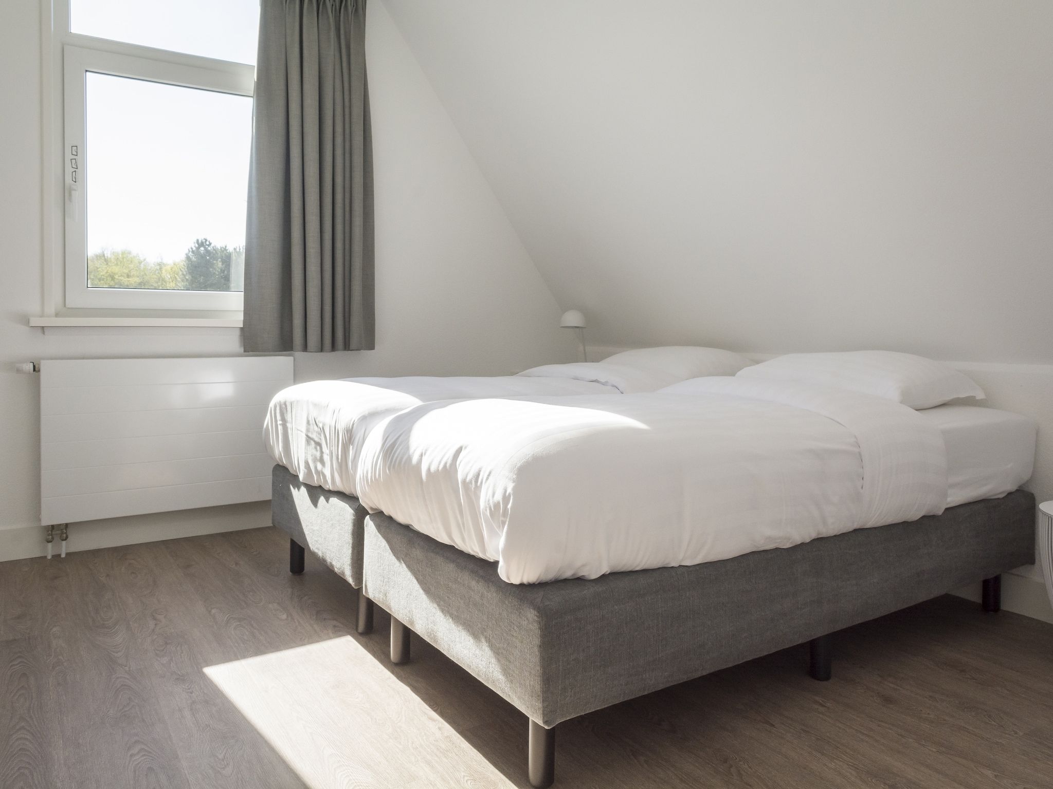Een slaapkamer van Bouwlust E9 in De Cocksdorp Texel