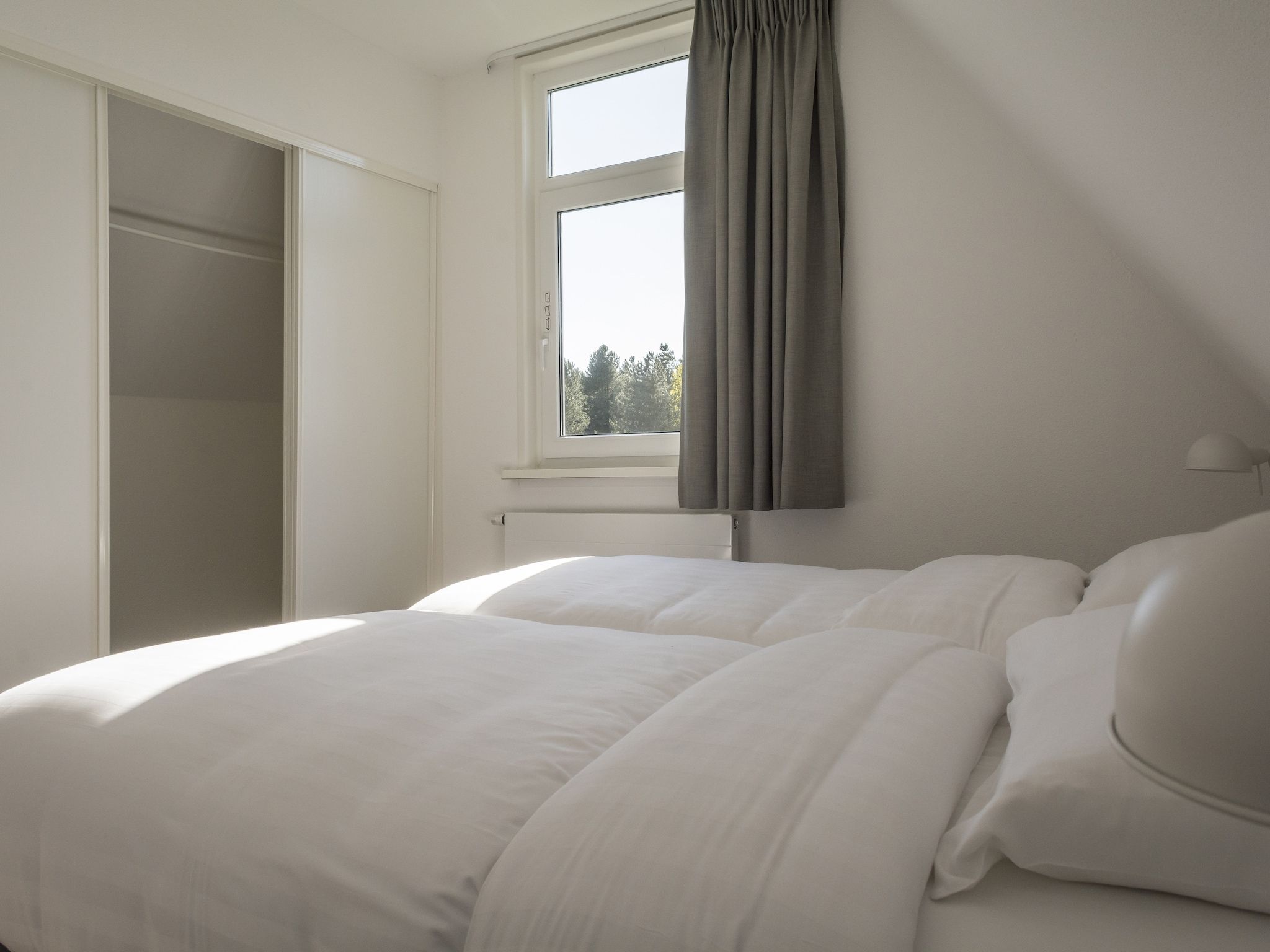 Een slaapkamer van Bouwlust E9 in De Cocksdorp Texel