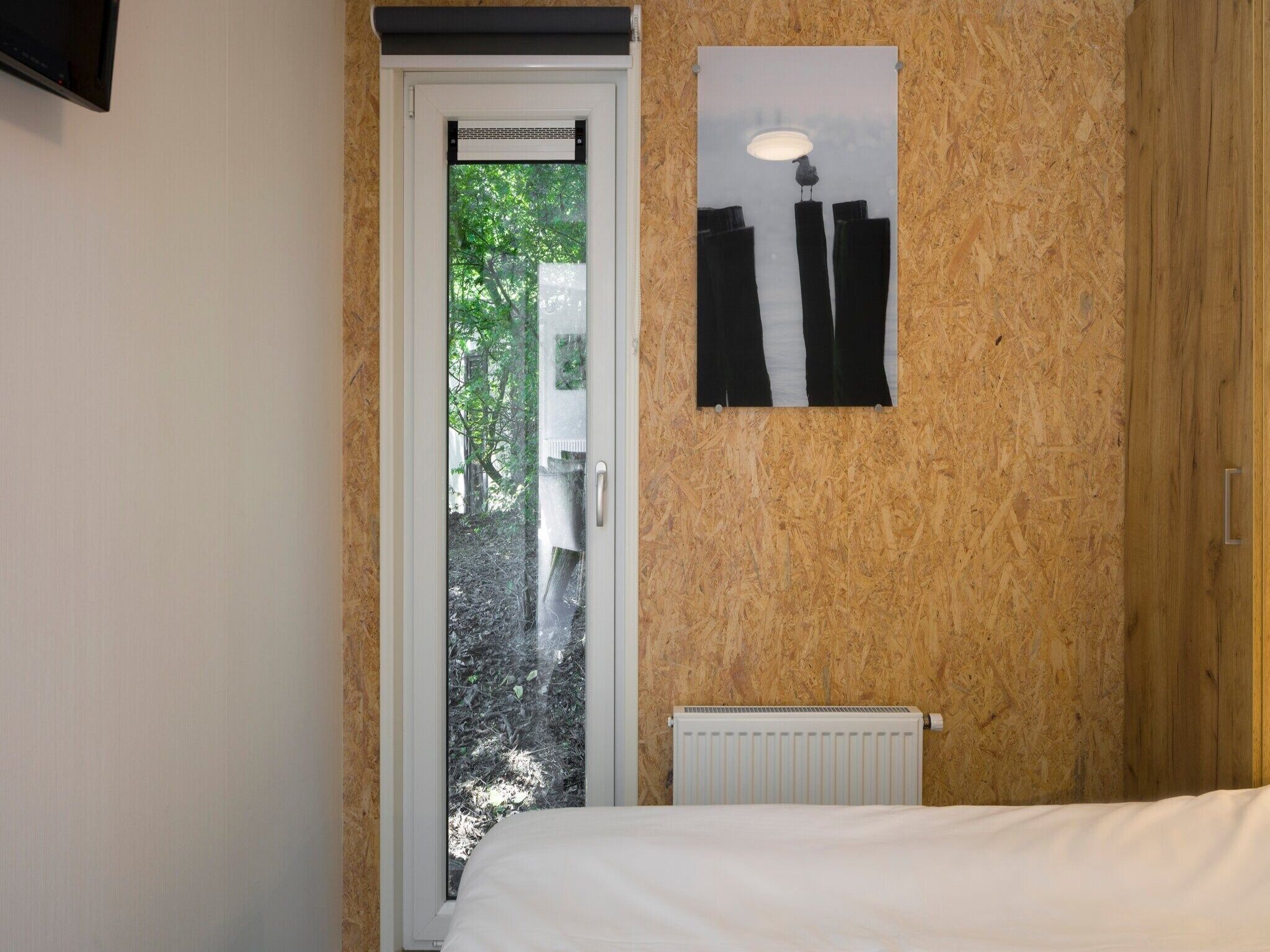 Een slaapkamer van Vakantiepark Beach Resort 7 in Kamperland