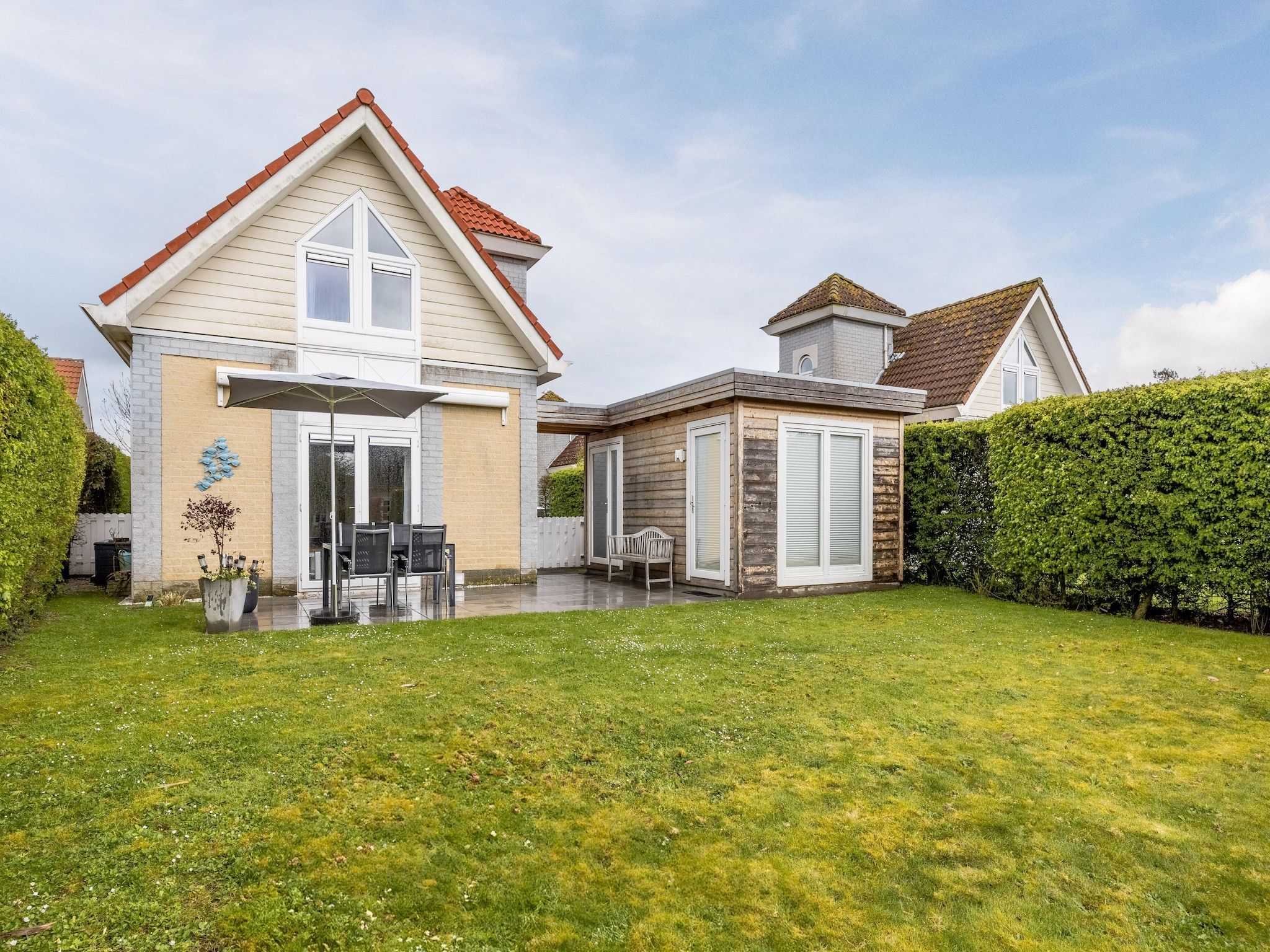 De tuin van Noordzee Résidence De Banjaard 13 in Kamperland