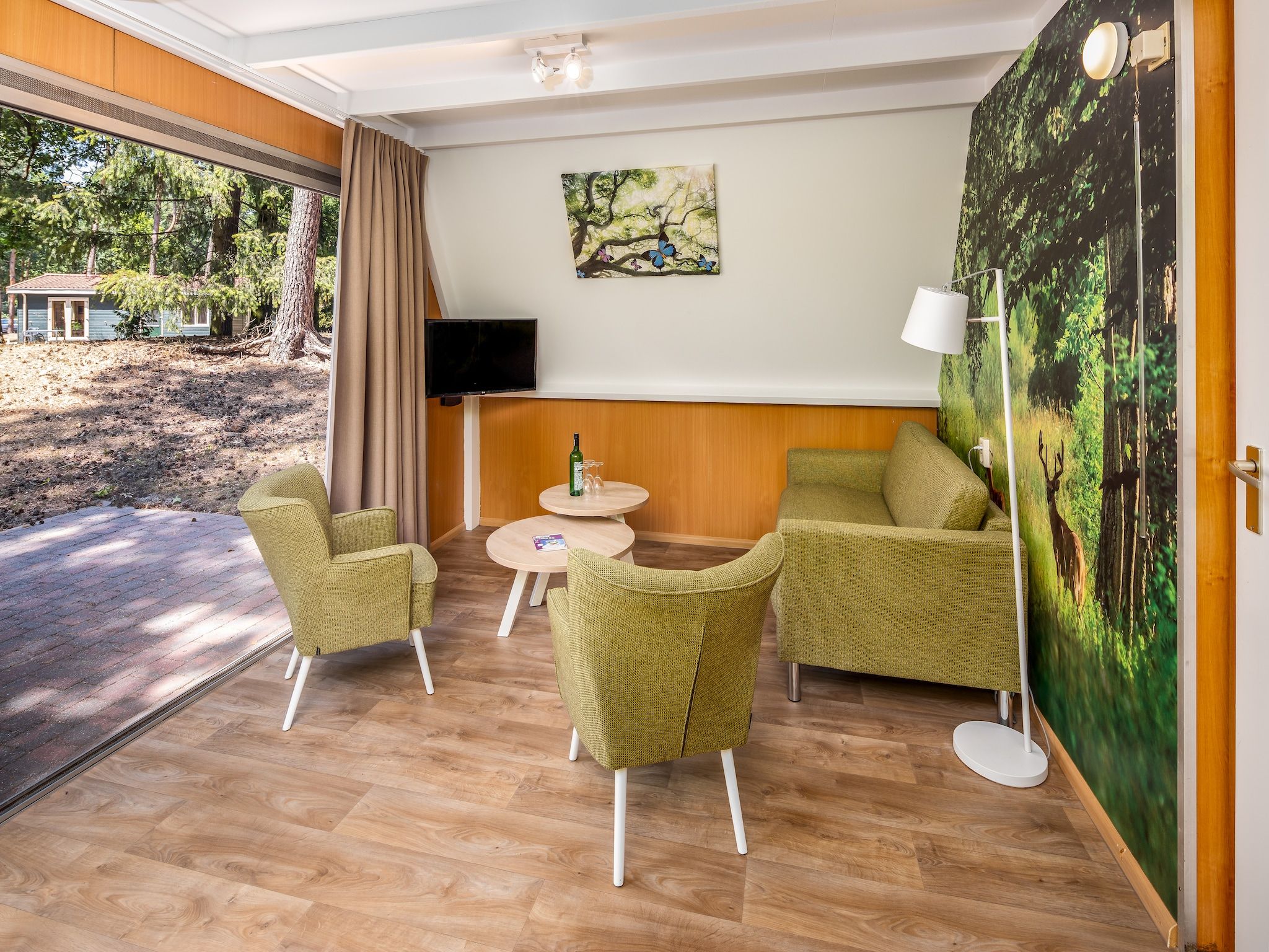 De woonkamer van Bospark 't Wolfsven 7 in Mierlo