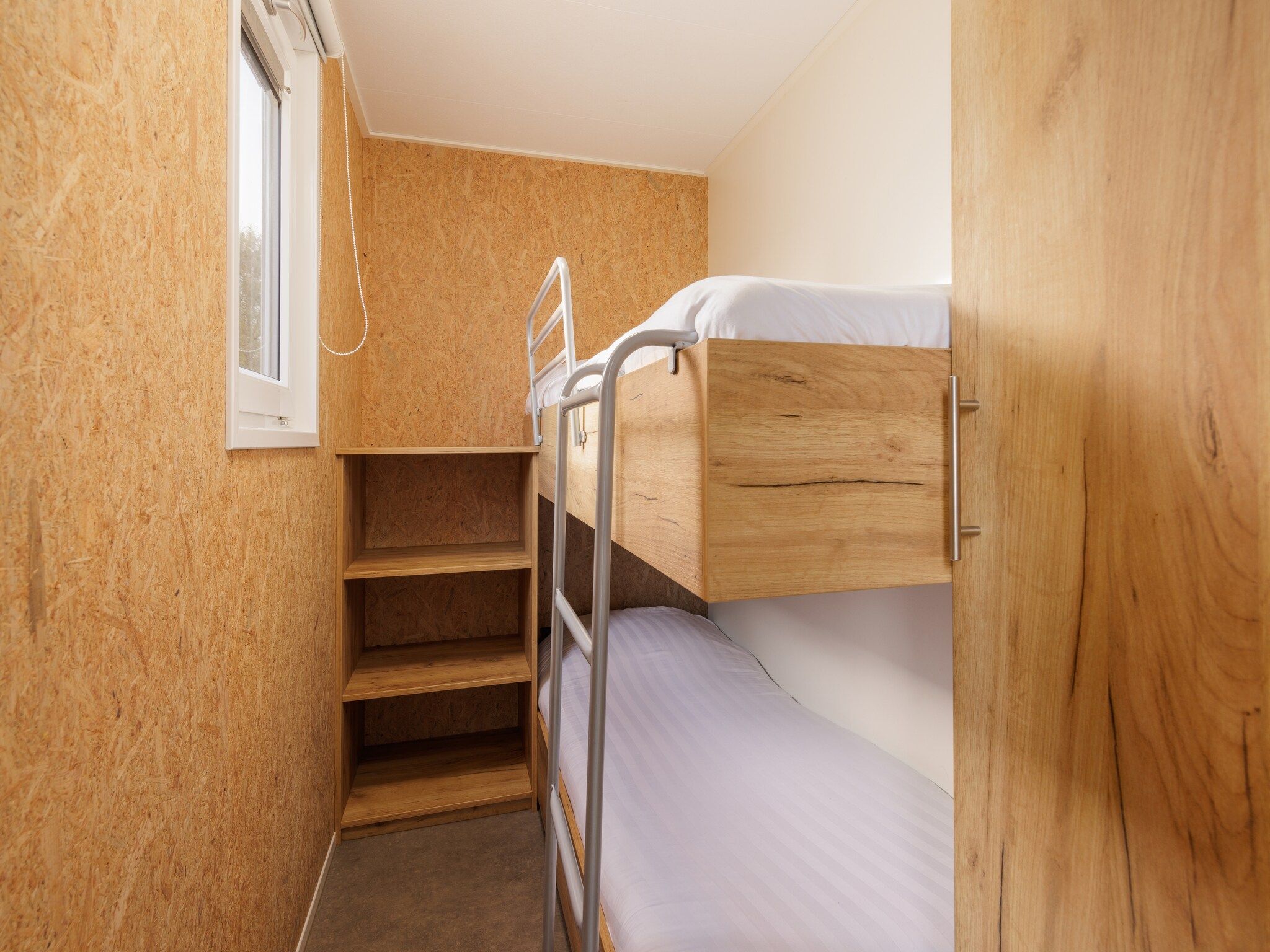 Een slaapkamer van Vakantiepark Hunzedal 9 in Borger