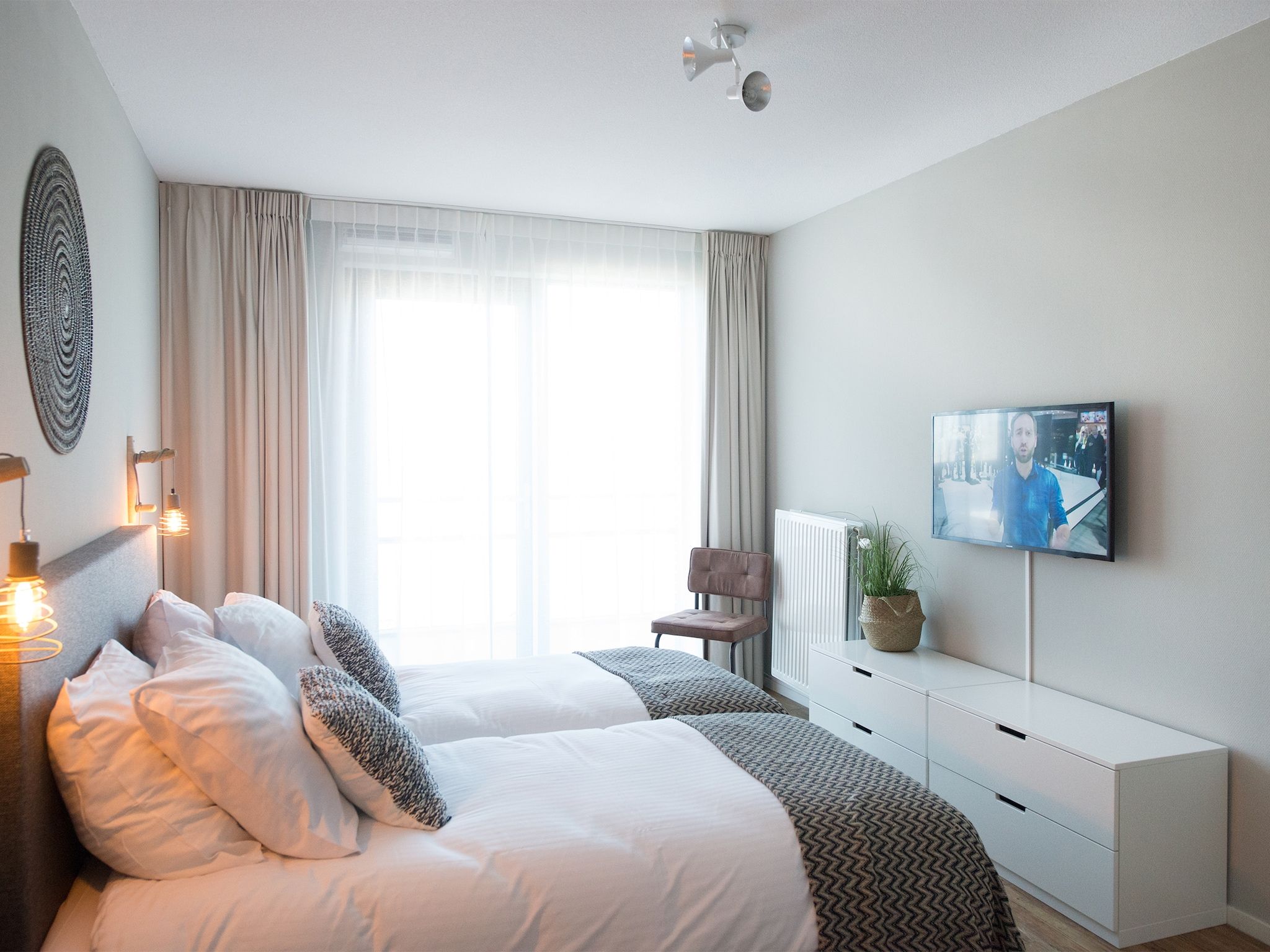 Een slaapkamer van Scheveningen Harbour 66 in Scheveningen