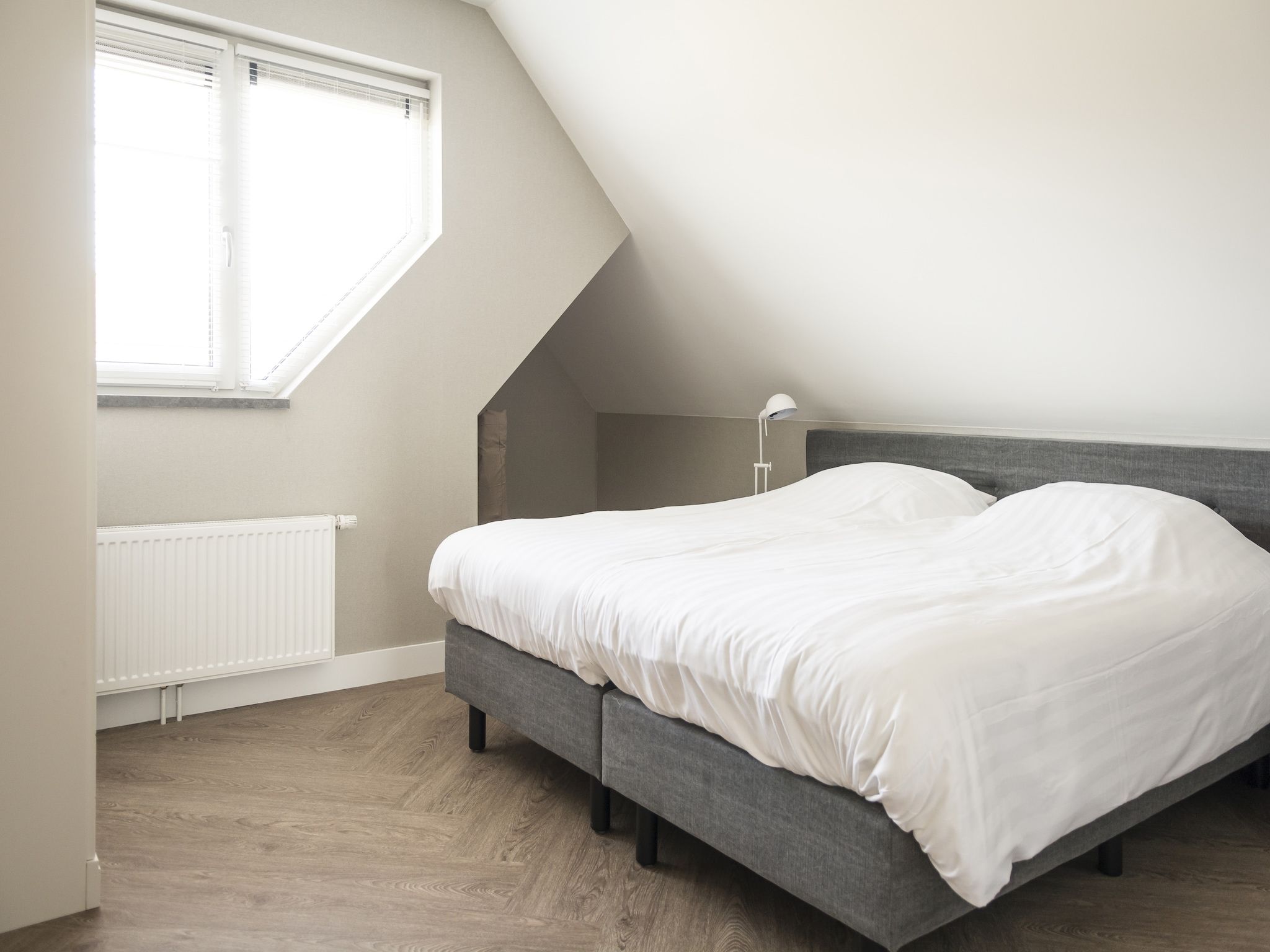 Een slaapkamer van Villa Bouwlust F Wellness in De Cocksdorp Texel