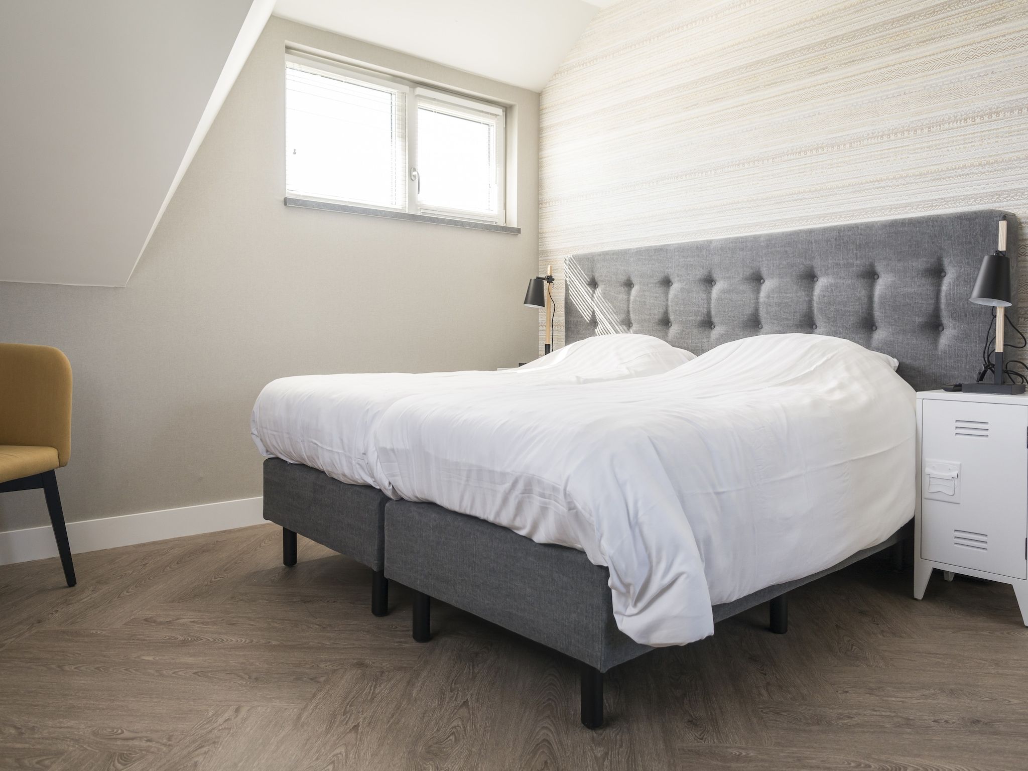 Een slaapkamer van Villa Bouwlust F Wellness in De Cocksdorp Texel