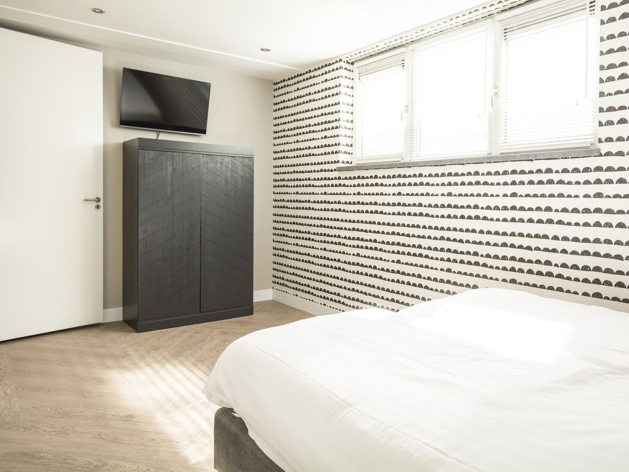 Een slaapkamer van Villa Bouwlust F Wellness in De Cocksdorp Texel