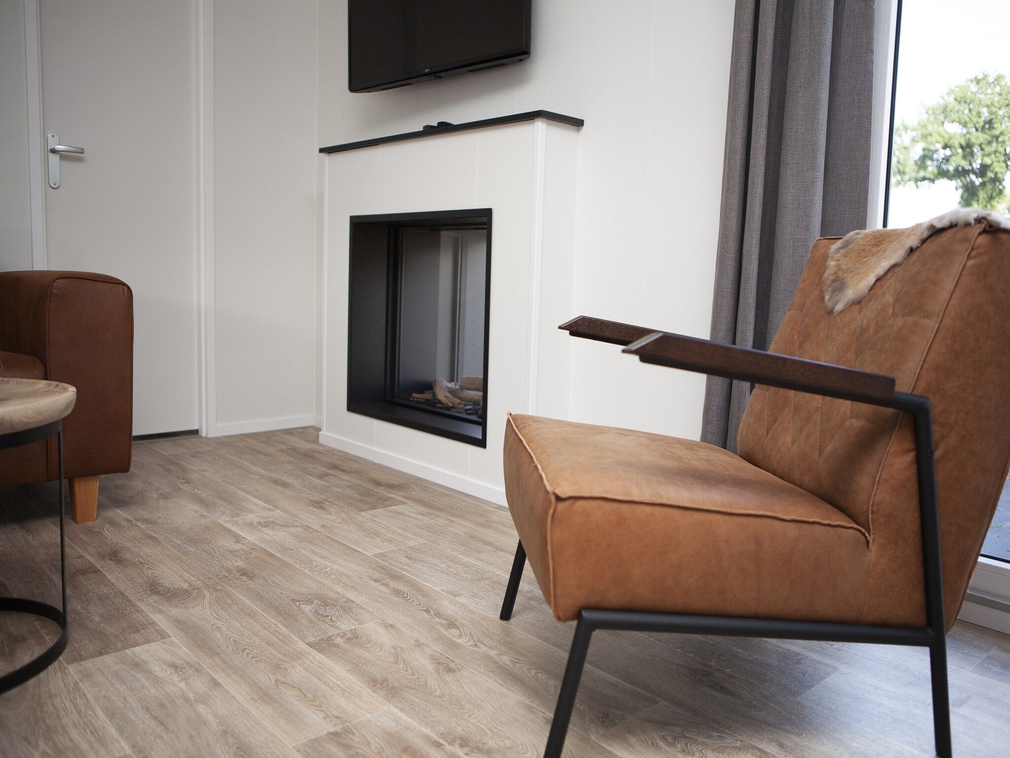 De woonkamer van Recreatiepark de Boshoek 21 in Voorthuizen