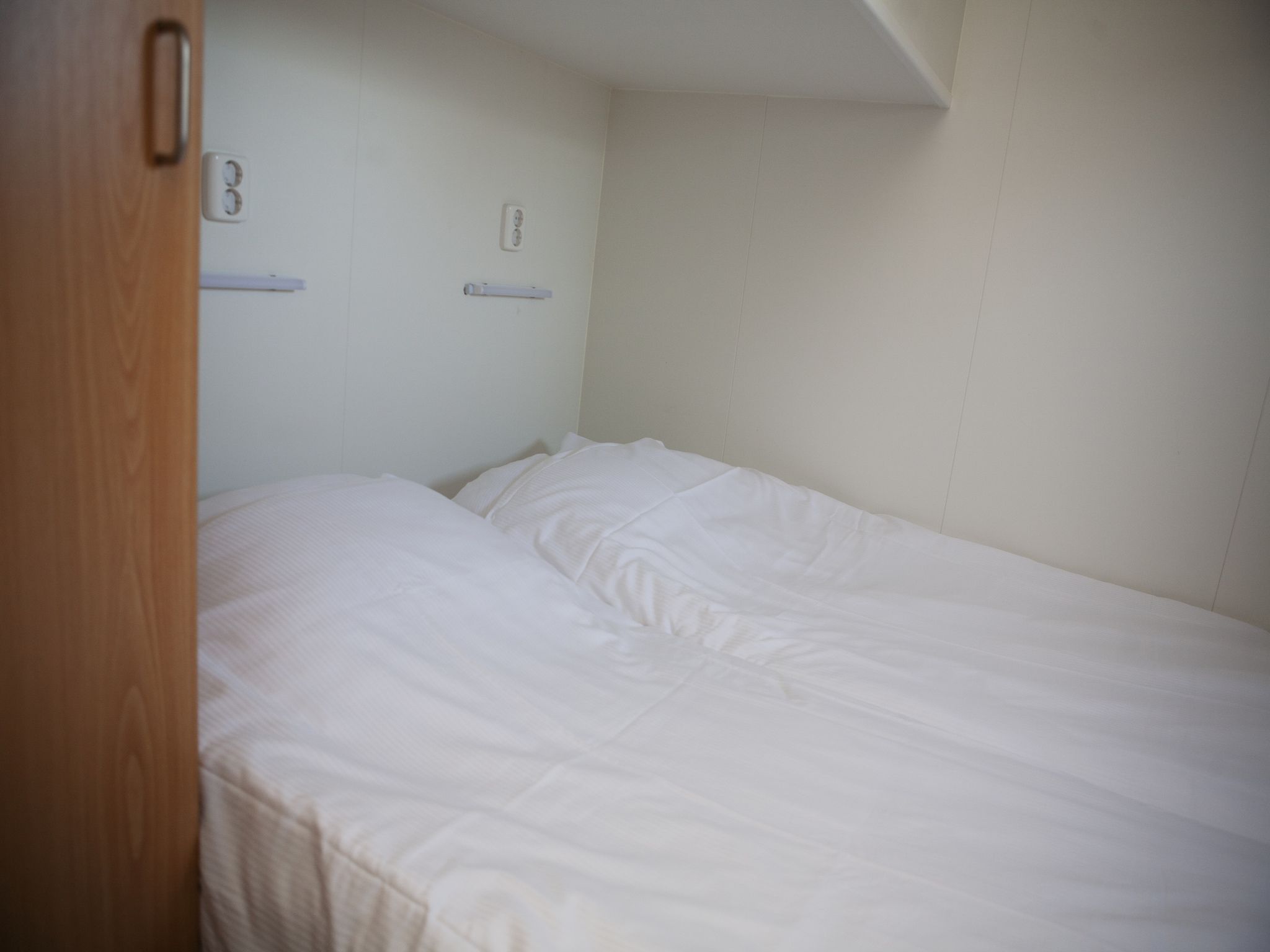 Een slaapkamer van Recreatiepark de Boshoek 22 in Voorthuizen