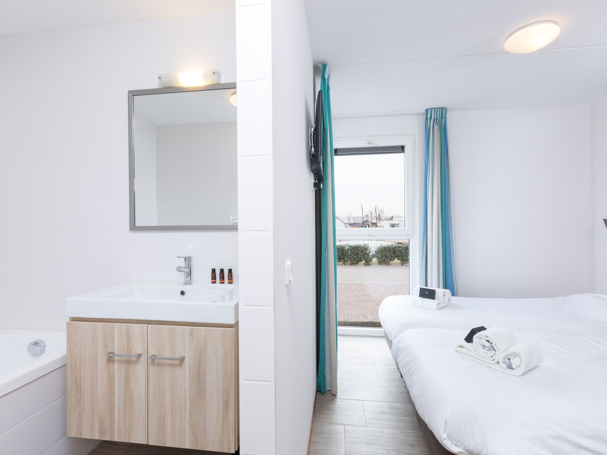 Een slaapkamer van Strandpark Duynhille 4 in Ouddorp