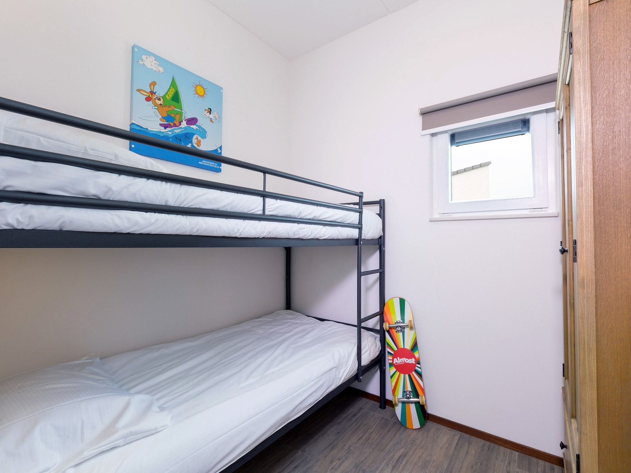 Een slaapkamer van Strandpark Duynhille 4 in Ouddorp