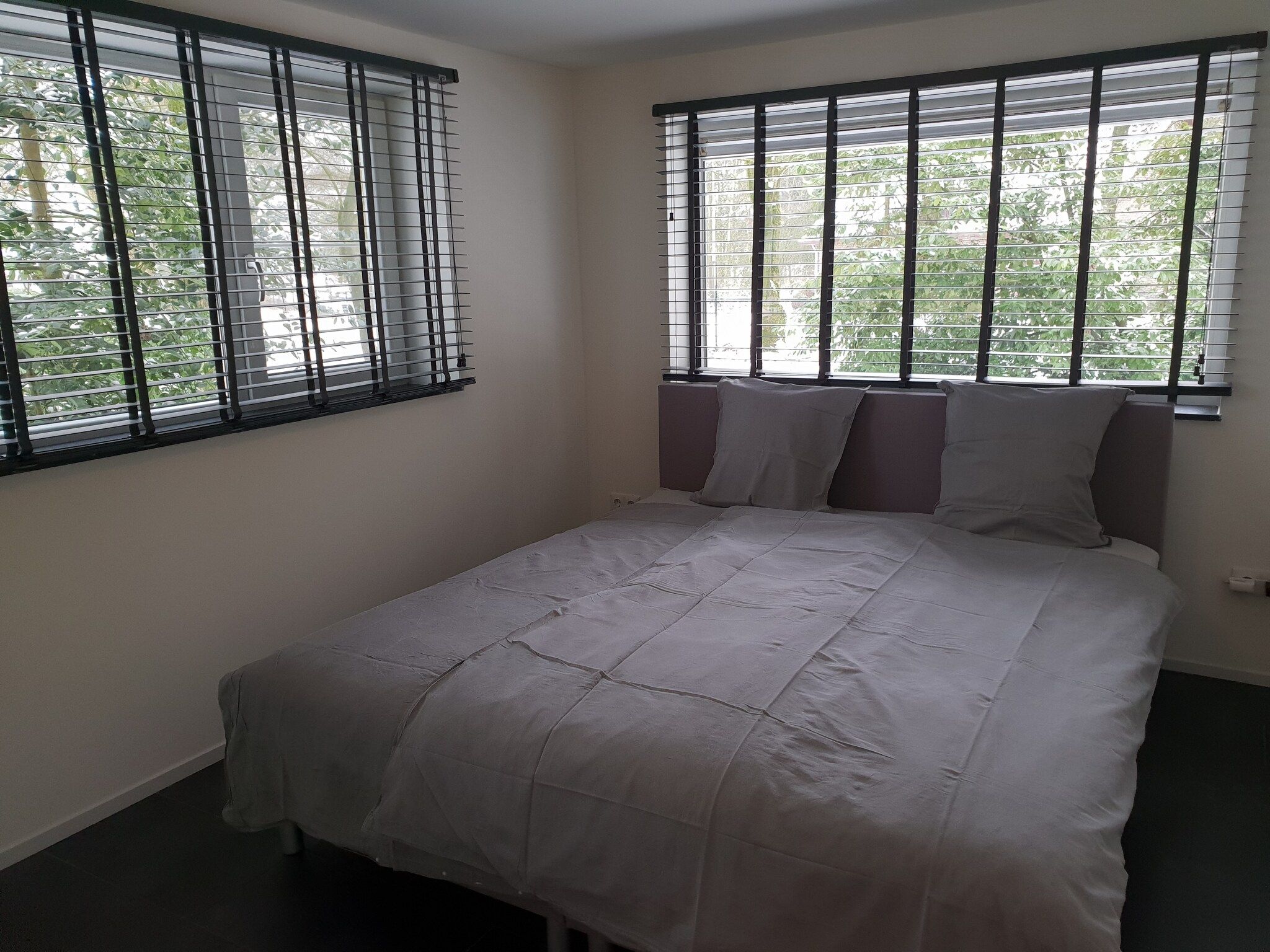 Een slaapkamer van Dorpswoning In het Bos in Leende