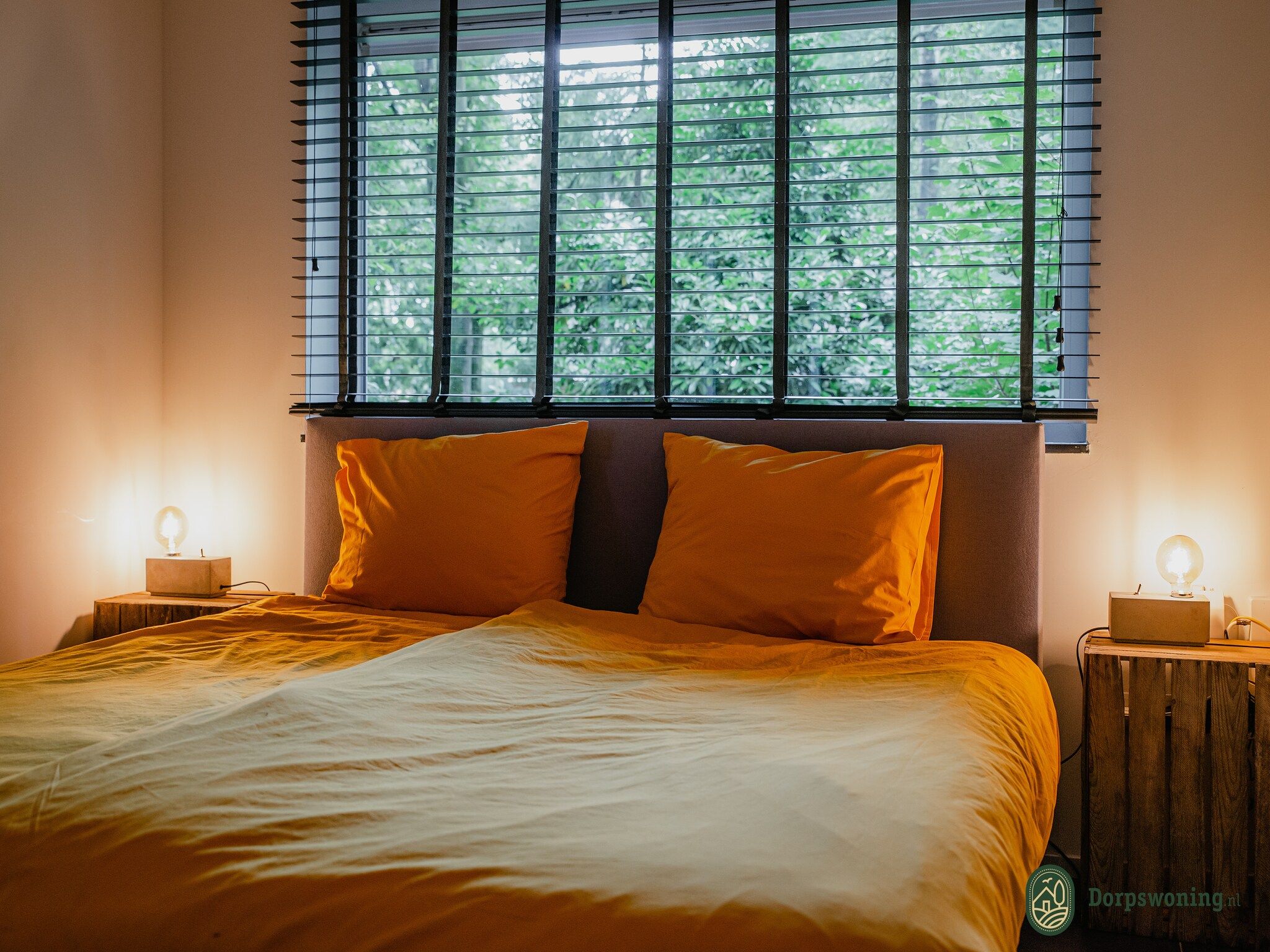 Een slaapkamer van Dorpswoning In het Bos in Leende