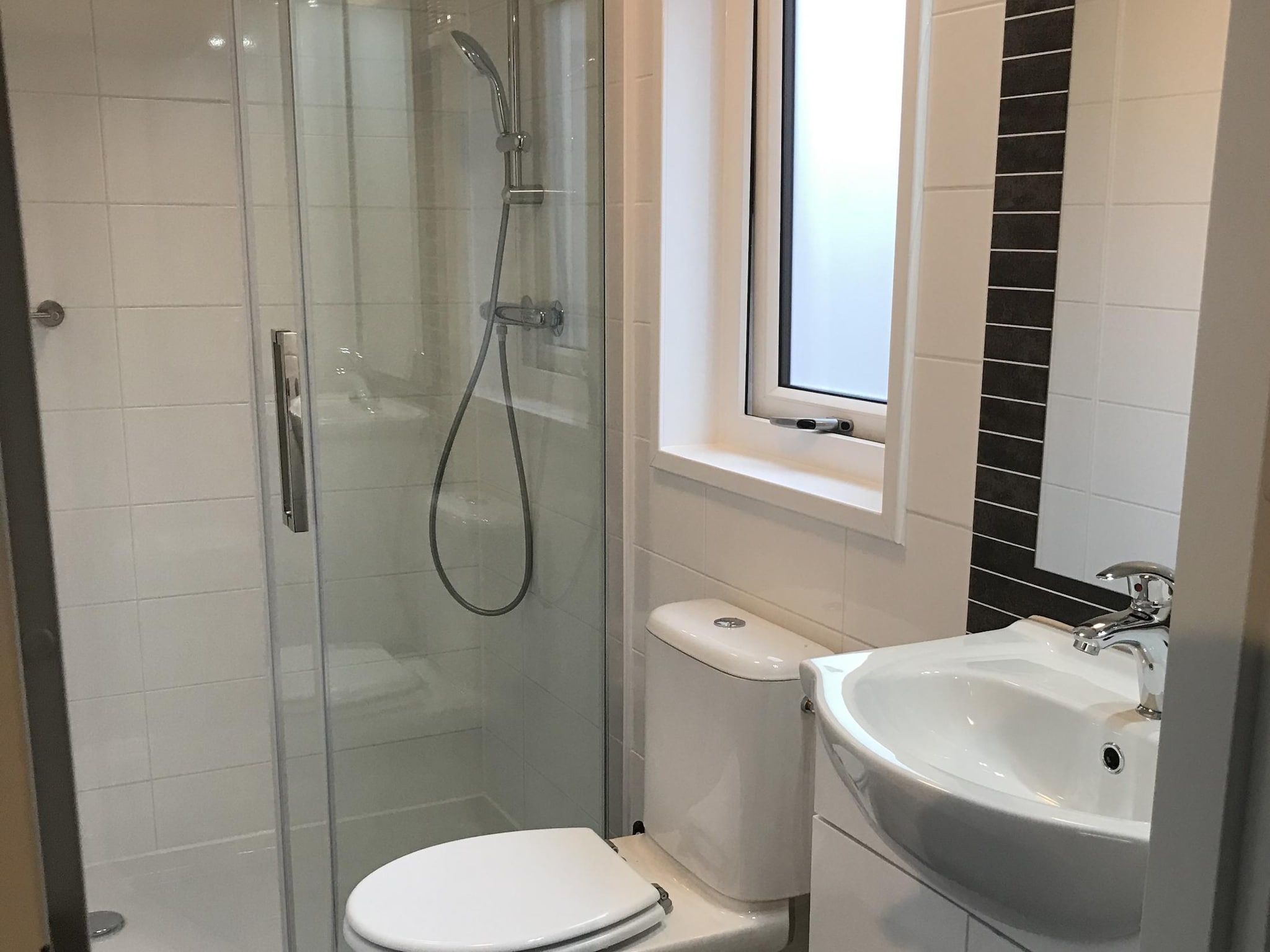 De badkamer van Vakantiepark de Tabaksschuur 3 in Elst