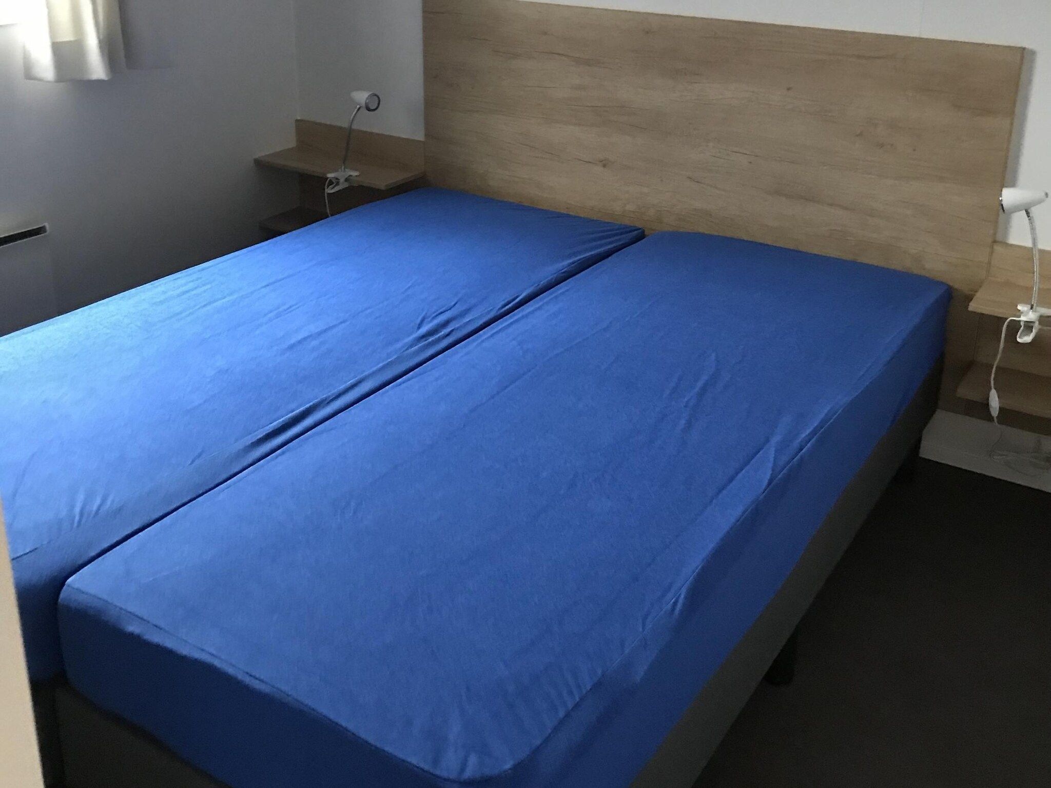 Een slaapkamer van Vakantiepark de Tabaksschuur 3 in Elst