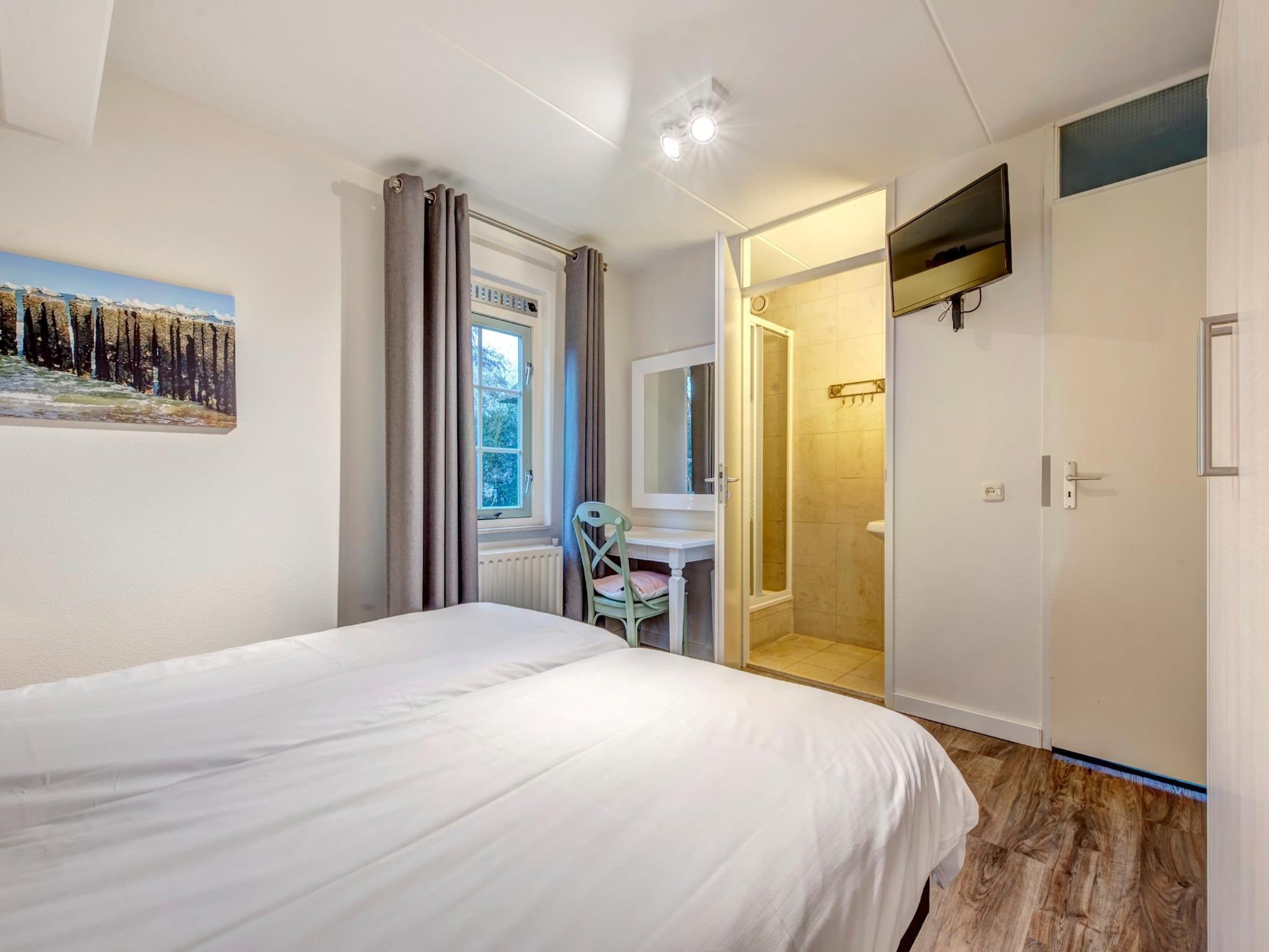 Een slaapkamer van Buitenhof Domburg 13 in Domburg