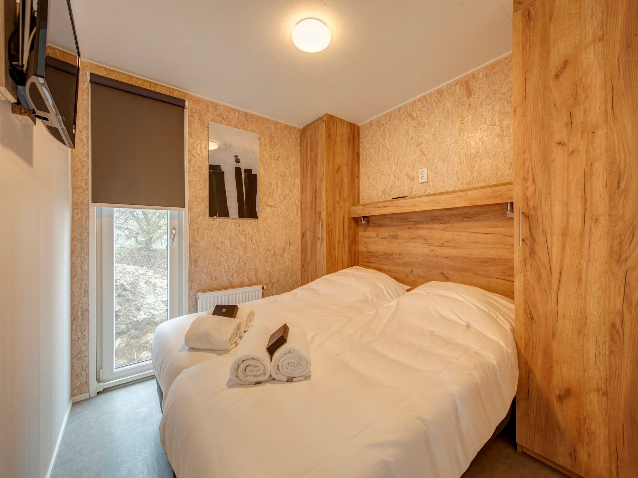 Een slaapkamer van Vakantiepark Kijkduin 9 in Den Haag