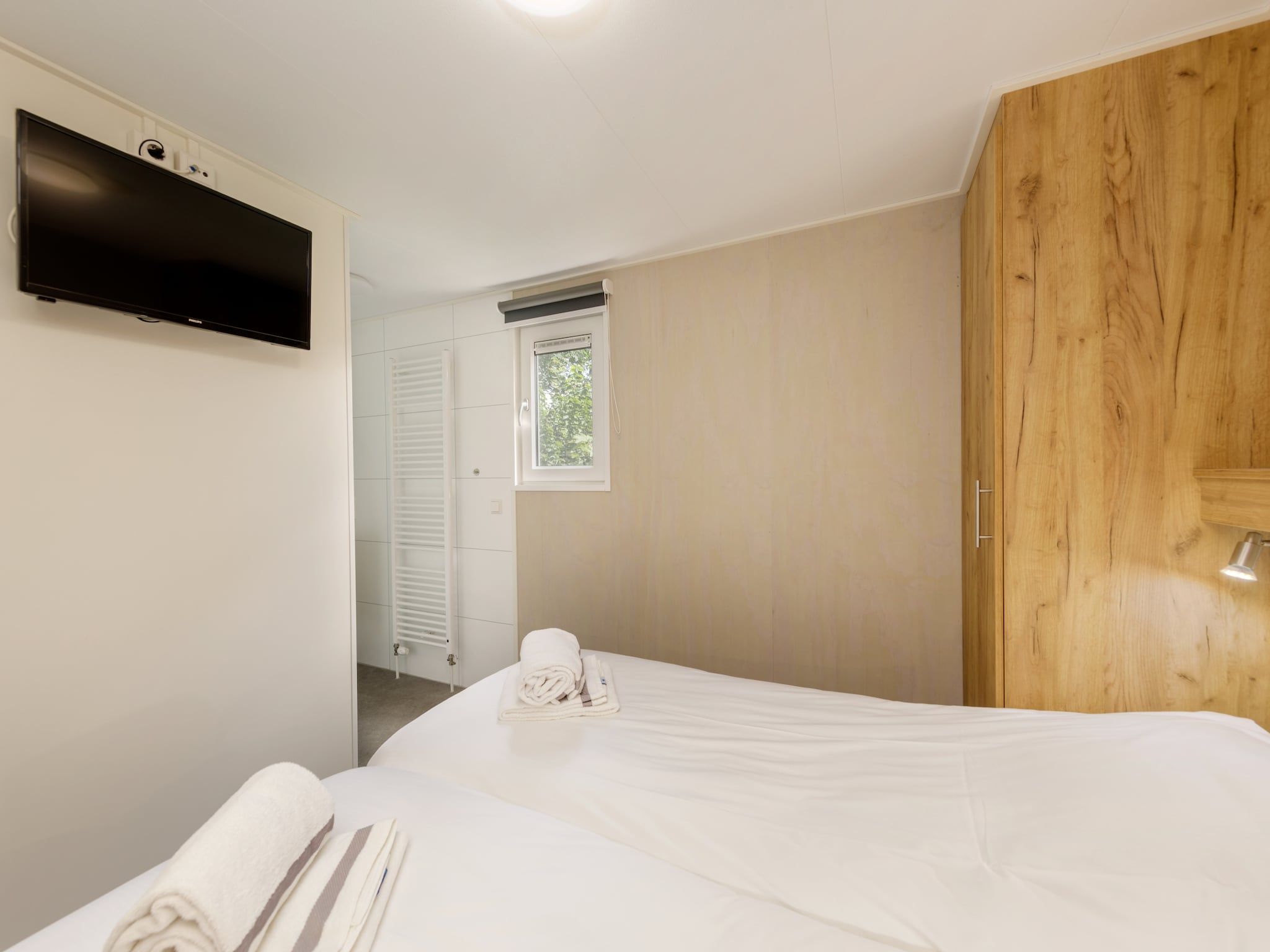 Een slaapkamer van Vakantiepark Kijkduin 9 in Den Haag