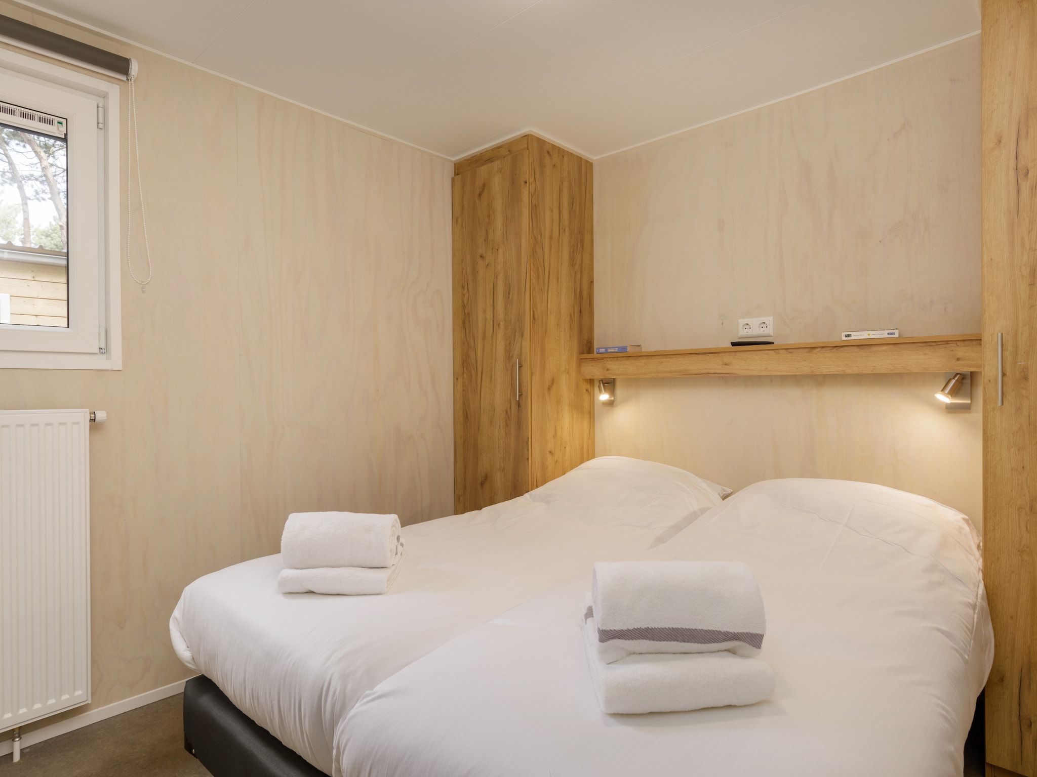 Een slaapkamer van Vakantiepark Kijkduin 10 in Den Haag