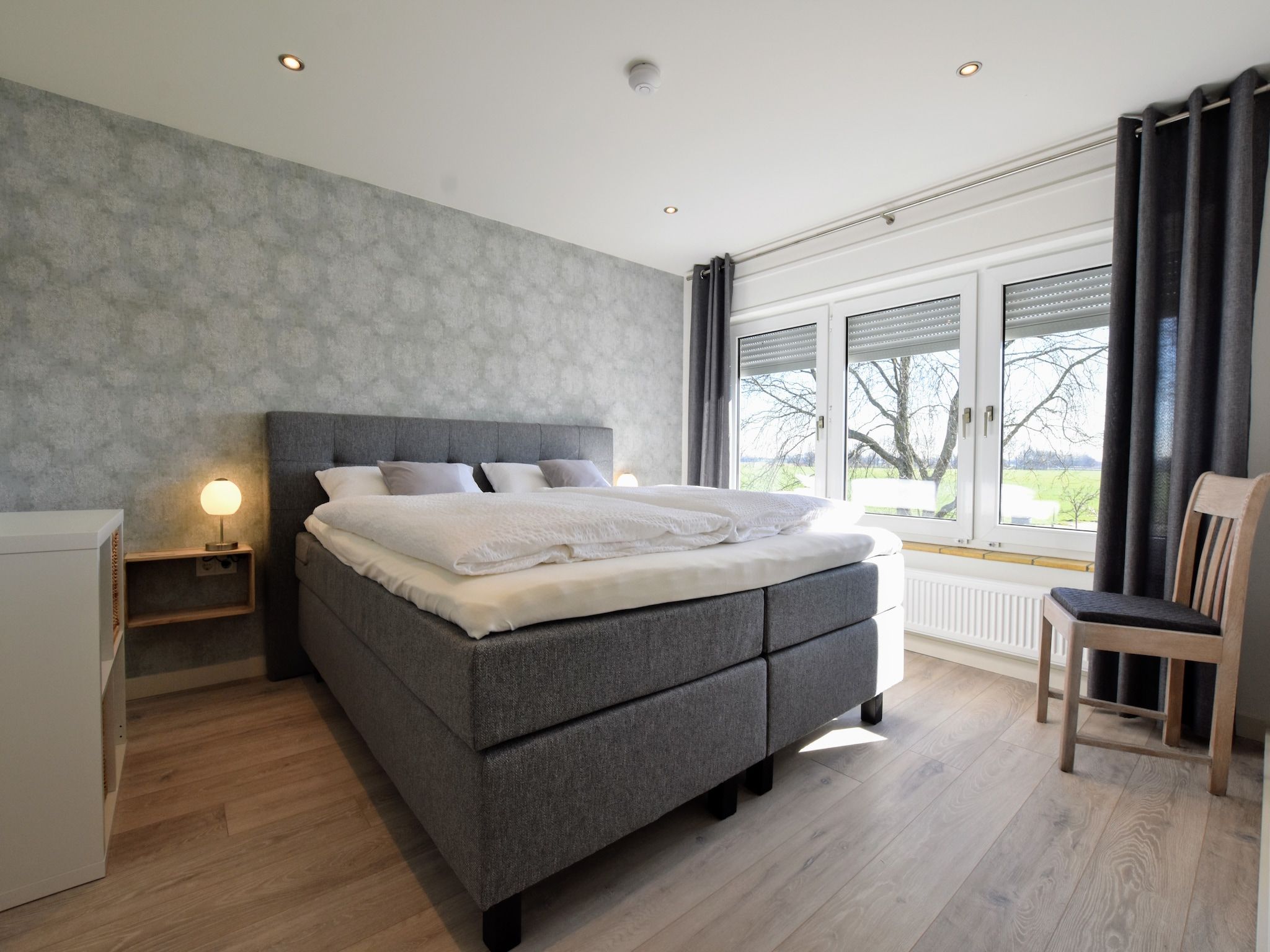 Een slaapkamer van Villa Grenszicht in Megchelen