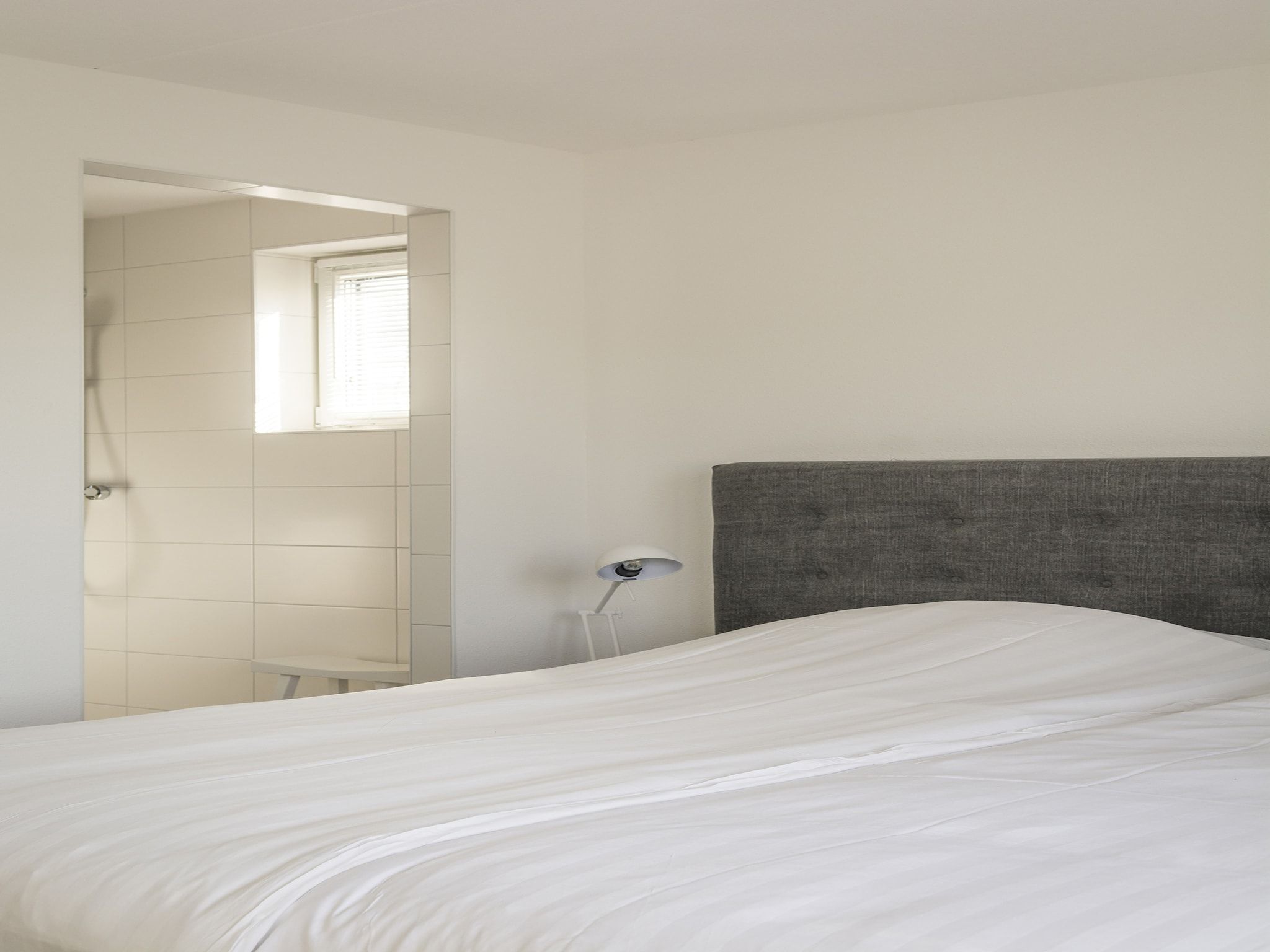 Een slaapkamer van Landhuis Bouwlust K in De Cocksdorp Texel