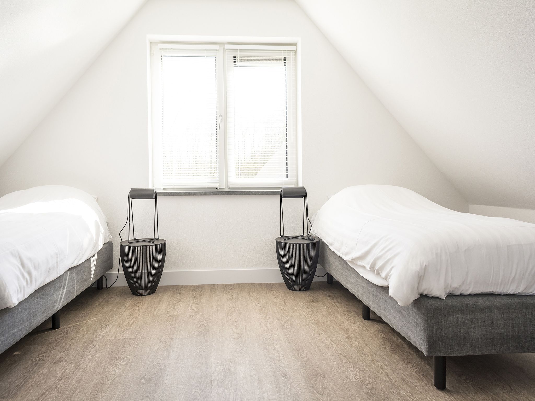 Een slaapkamer van Landhuis Bouwlust K in De Cocksdorp Texel