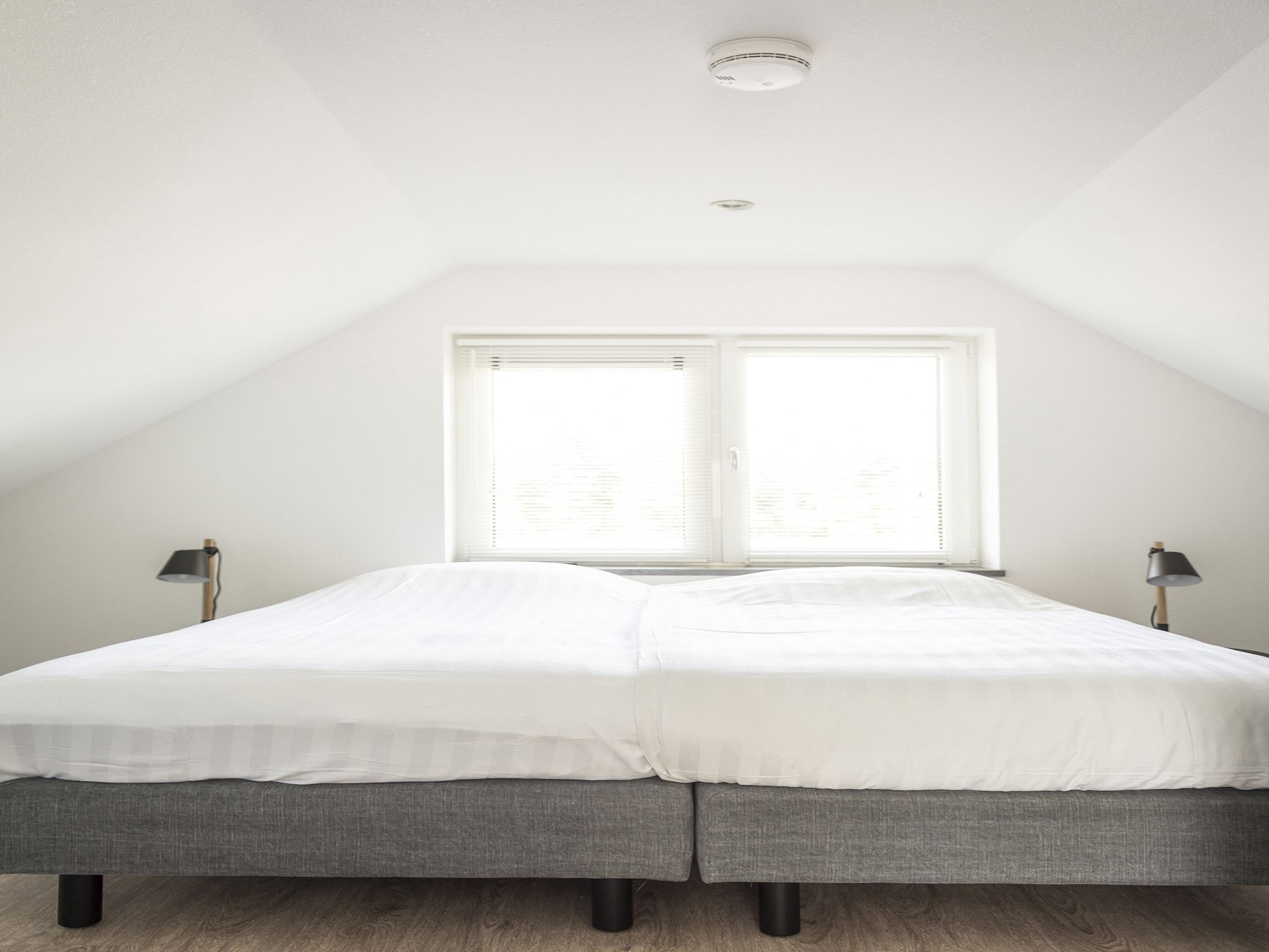 Een slaapkamer van Landhuis Bouwlust K in De Cocksdorp Texel