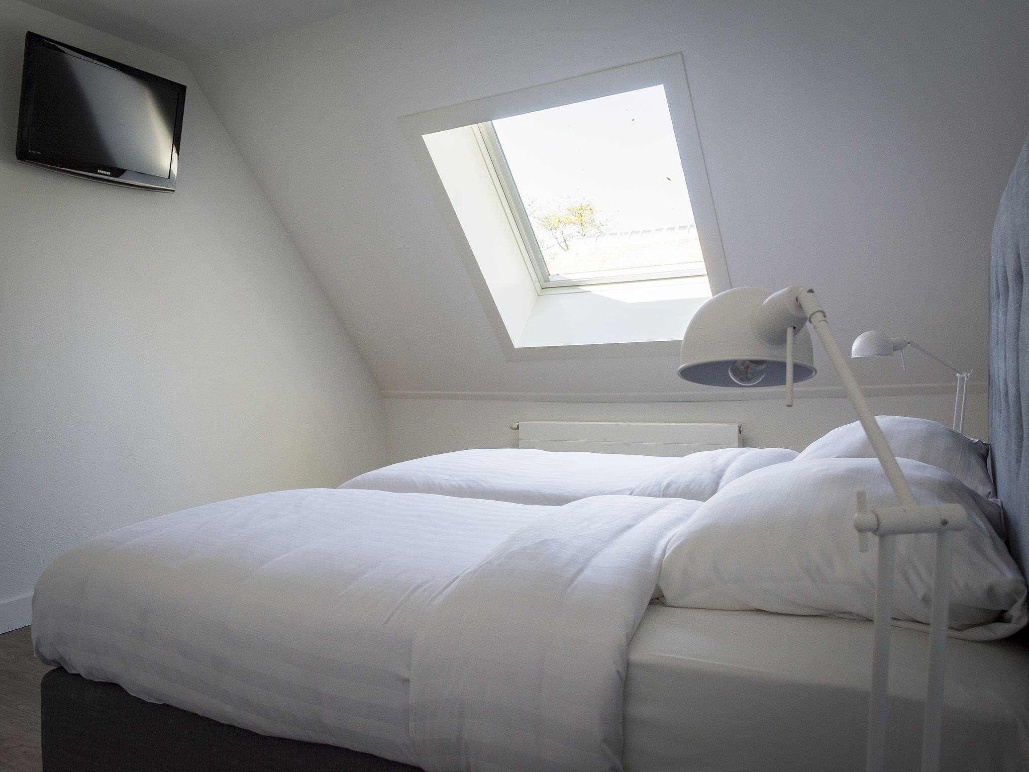 Een slaapkamer van Bouwlust G21A in De Cocksdorp - Texel