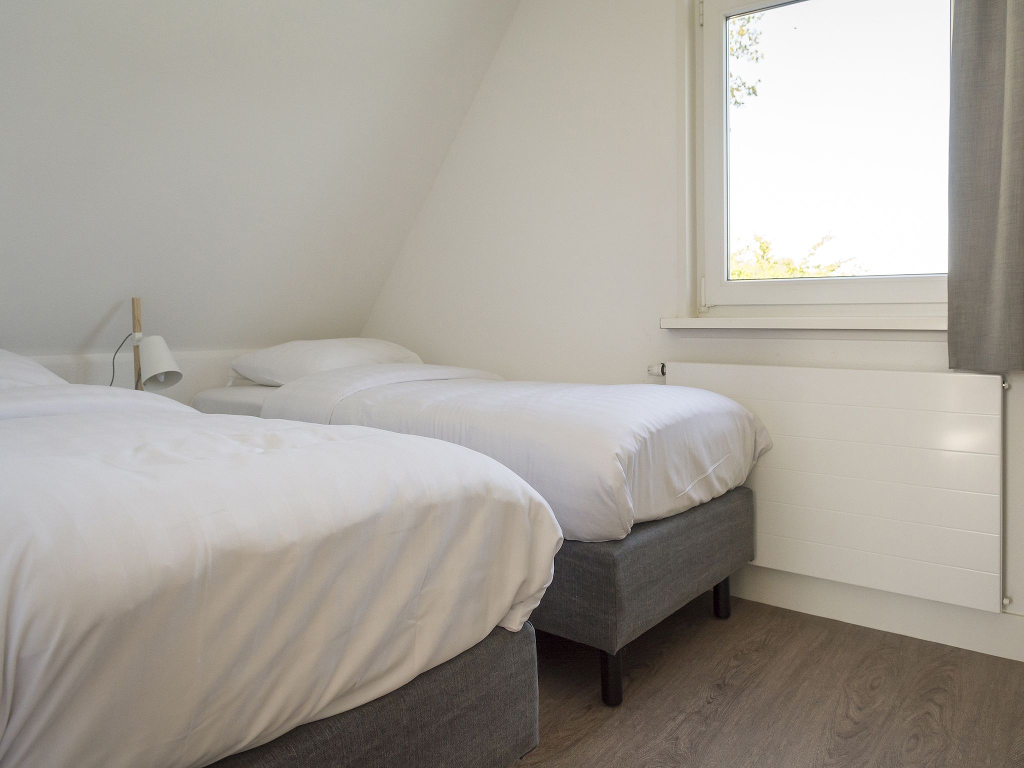 Een slaapkamer van Bouwlust E11 in De Cocksdorp Texel