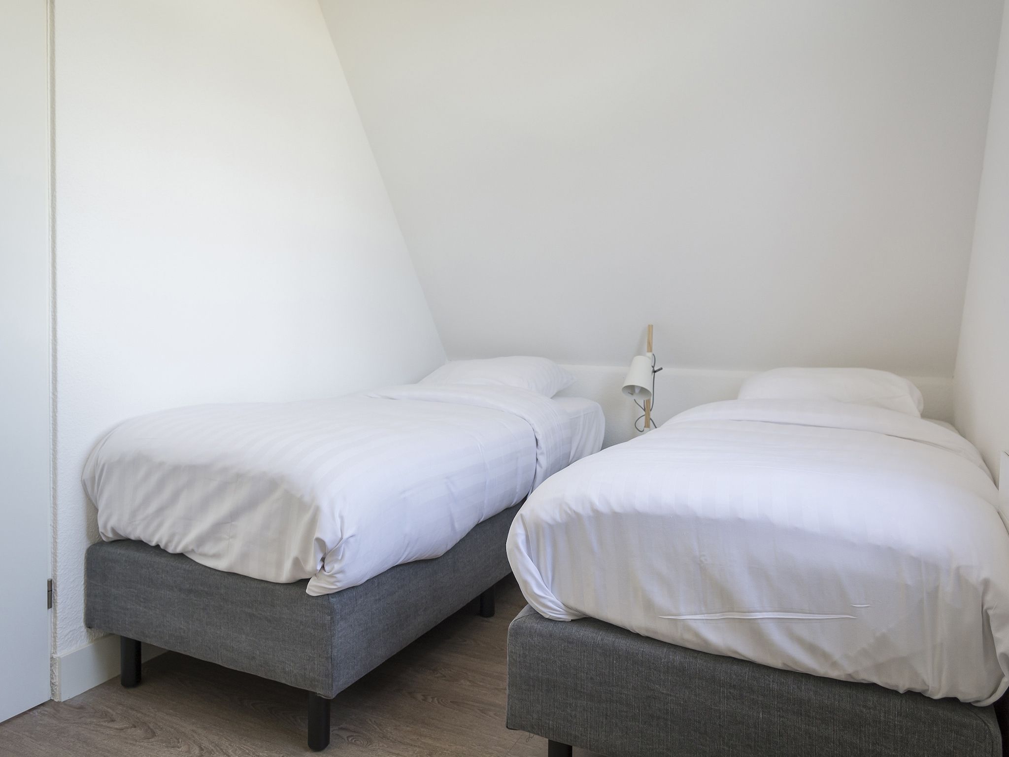 Een slaapkamer van Bouwlust E11 in De Cocksdorp Texel