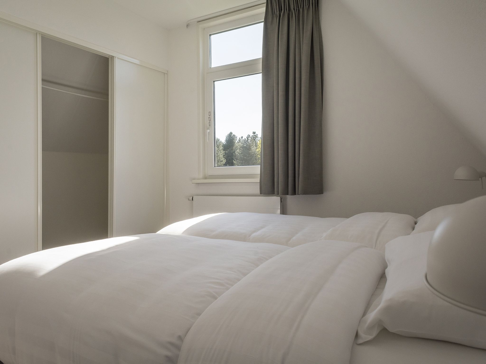 Een slaapkamer van Bouwlust E11 in De Cocksdorp Texel