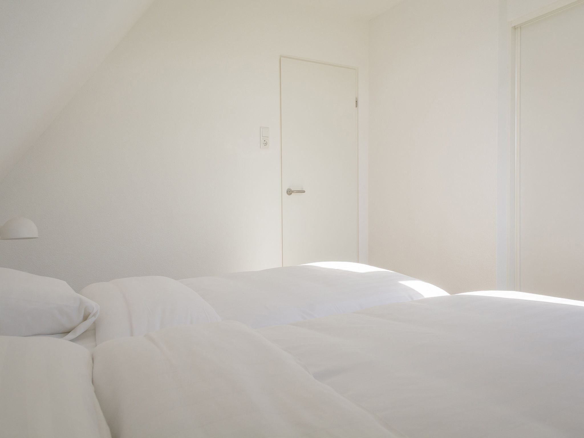 Een slaapkamer van Bouwlust E11 in De Cocksdorp Texel