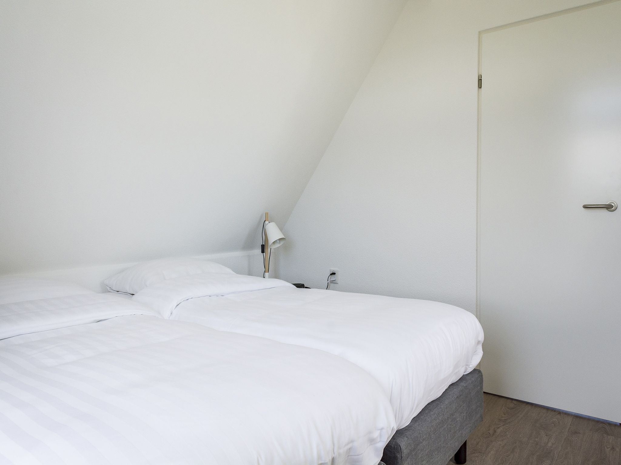Een slaapkamer van Bouwlust E23 in De Cocksdorp Texel