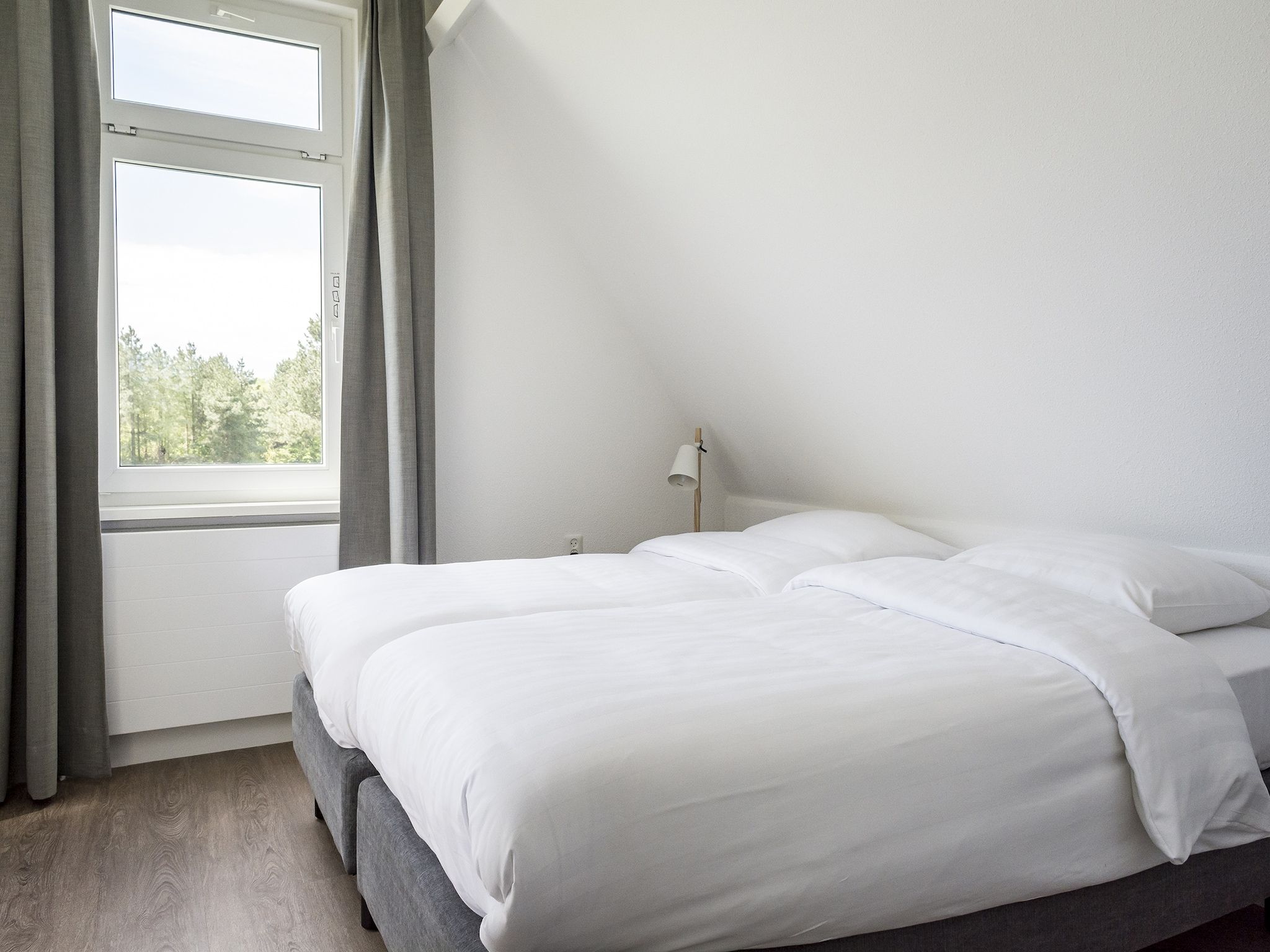 Een slaapkamer van Bouwlust E23 in De Cocksdorp Texel