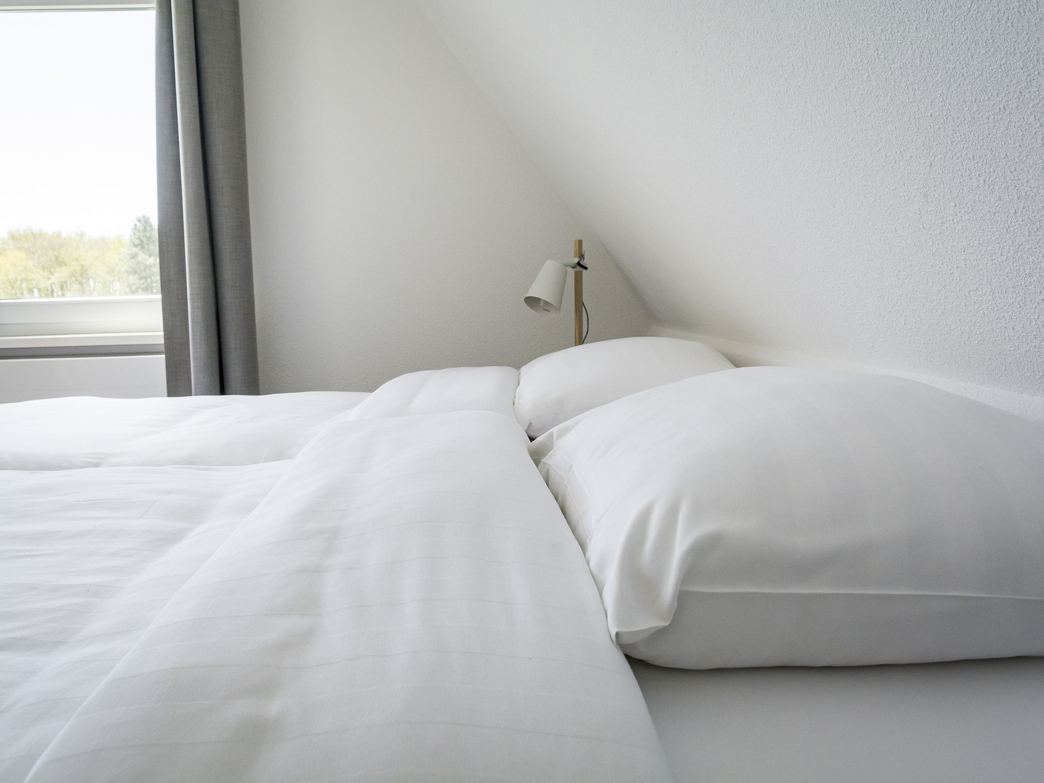 Een slaapkamer van Bouwlust E23 in De Cocksdorp Texel