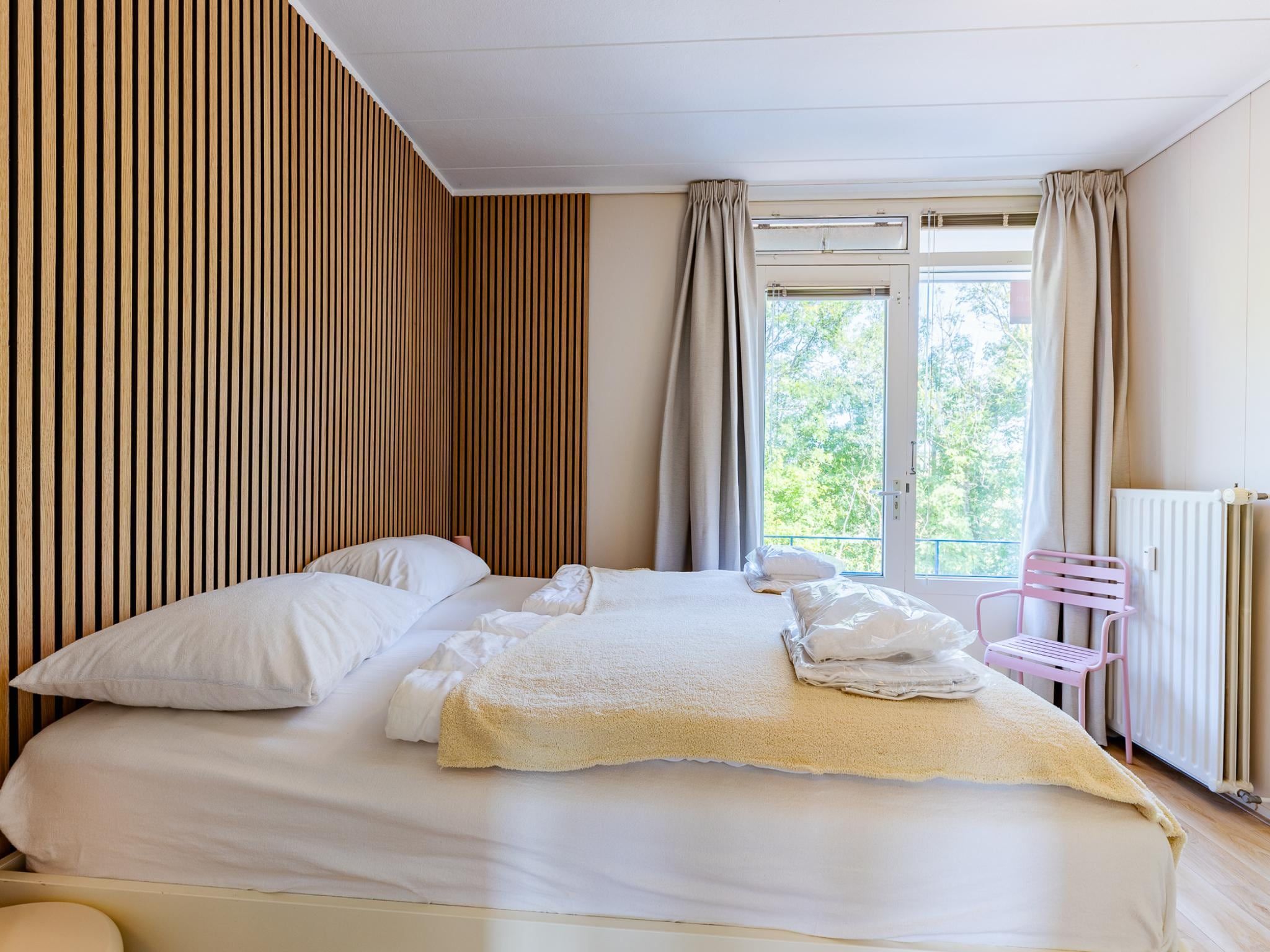 Een slaapkamer van Appartement Burg van Woelderenlaan in Vlissingen