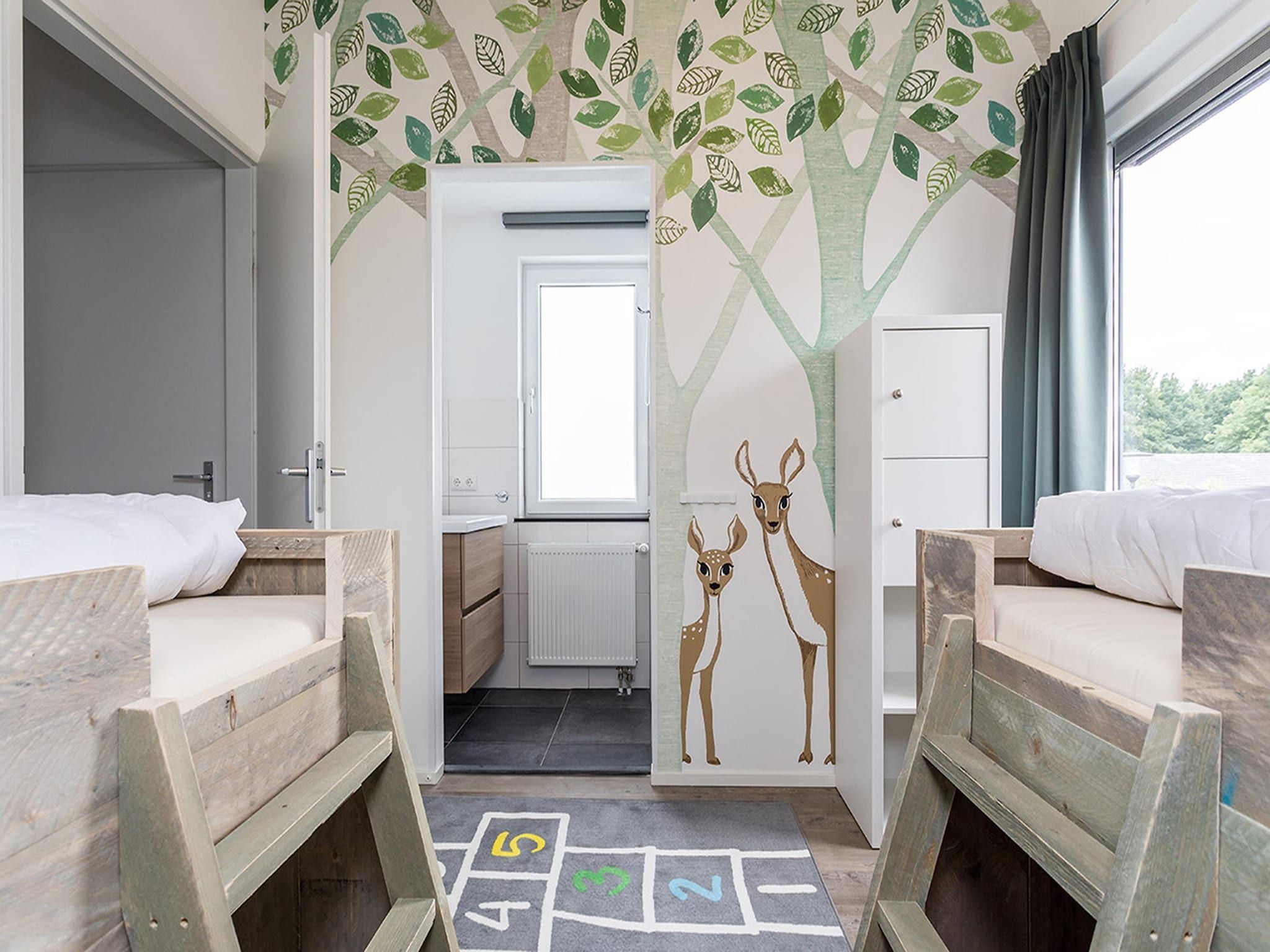 Een slaapkamer van Buitenhof De Leistert 22 in Roggel