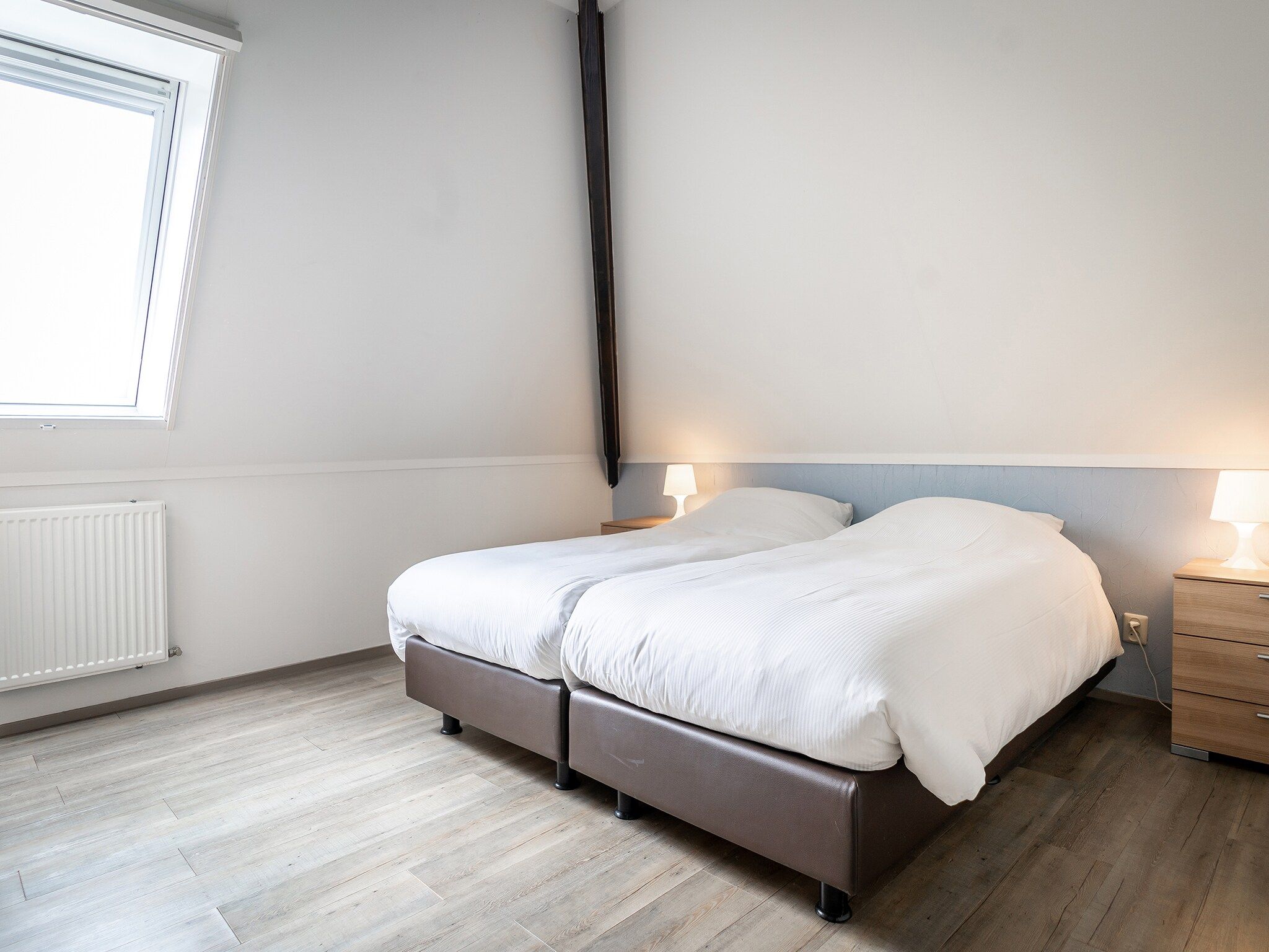 Een slaapkamer van App Hoeve Holland T4 in De Cocksdorp Texel