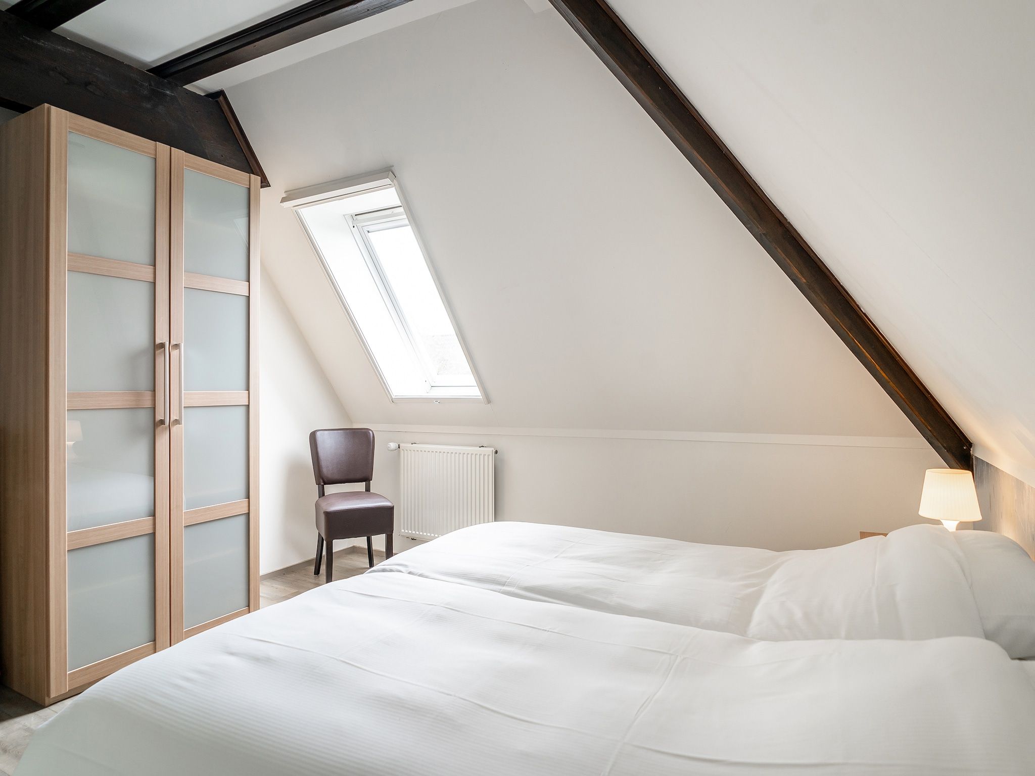 Een slaapkamer van App Hoeve Holland T4 in De Cocksdorp Texel