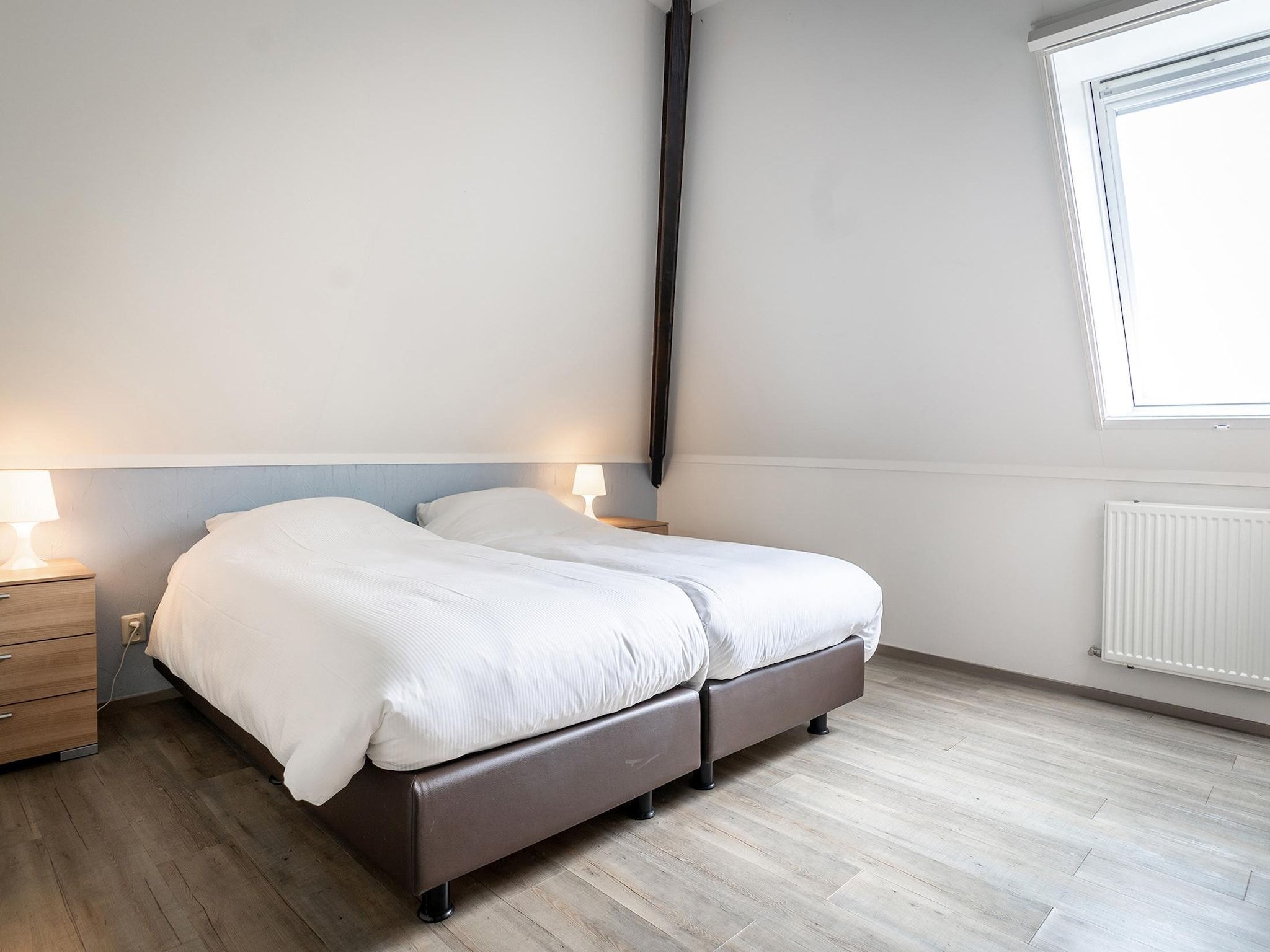 Een slaapkamer van App Hoeve Holland T4 in De Cocksdorp Texel