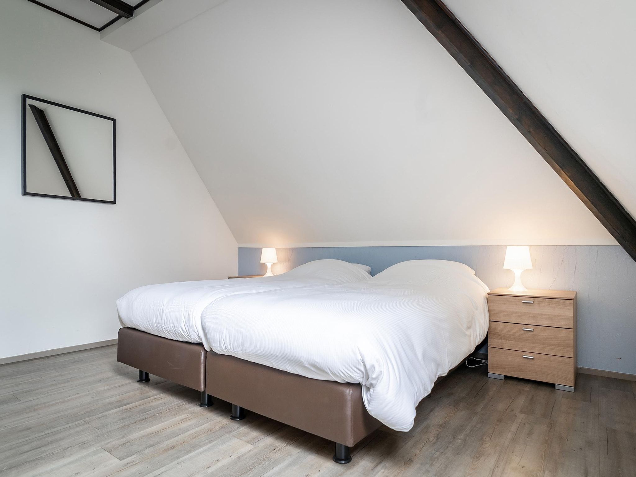 Een slaapkamer van App Hoeve Holland T4 in De Cocksdorp Texel