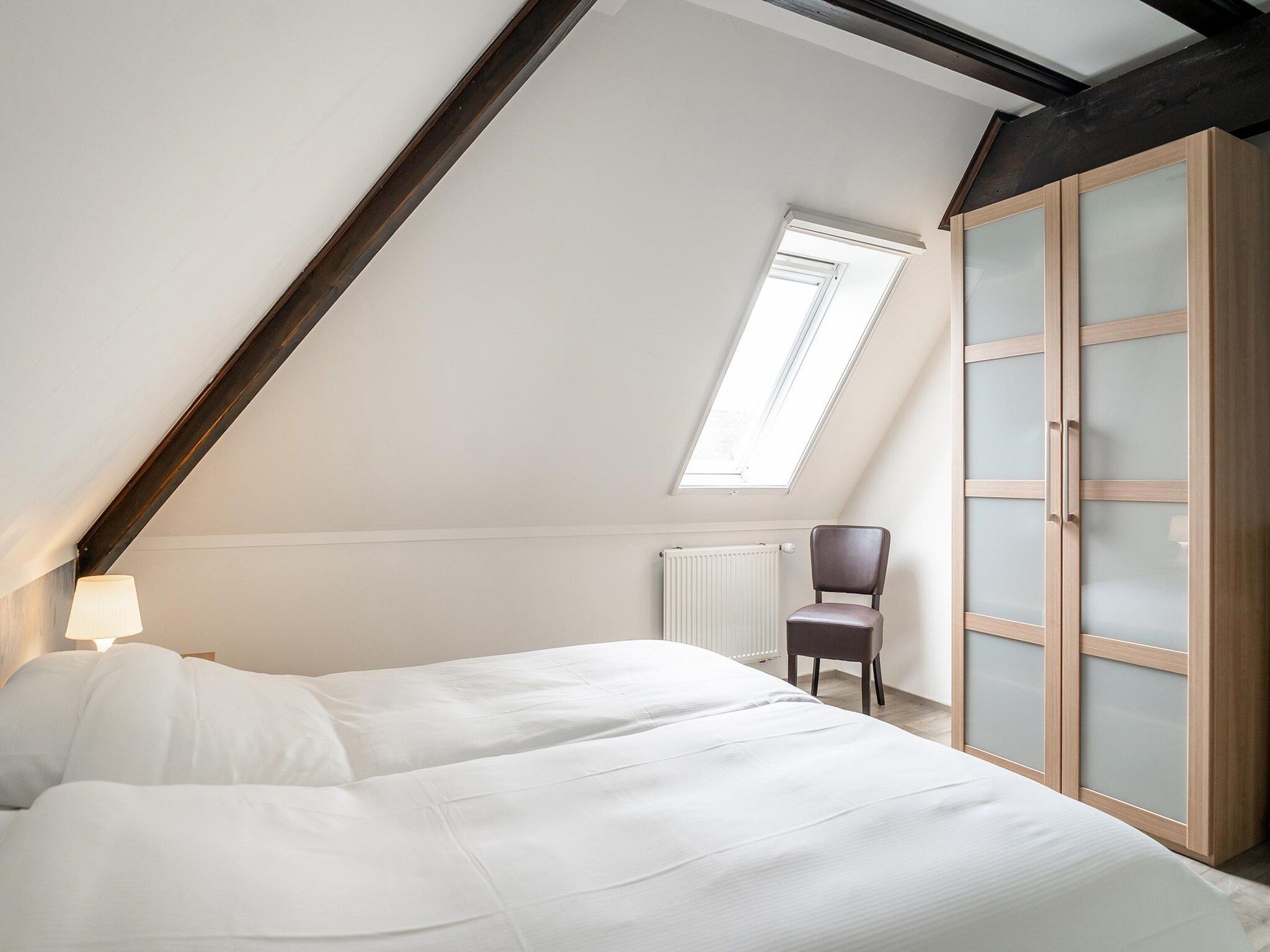 Een slaapkamer van App Hoeve Holland T4 in De Cocksdorp Texel