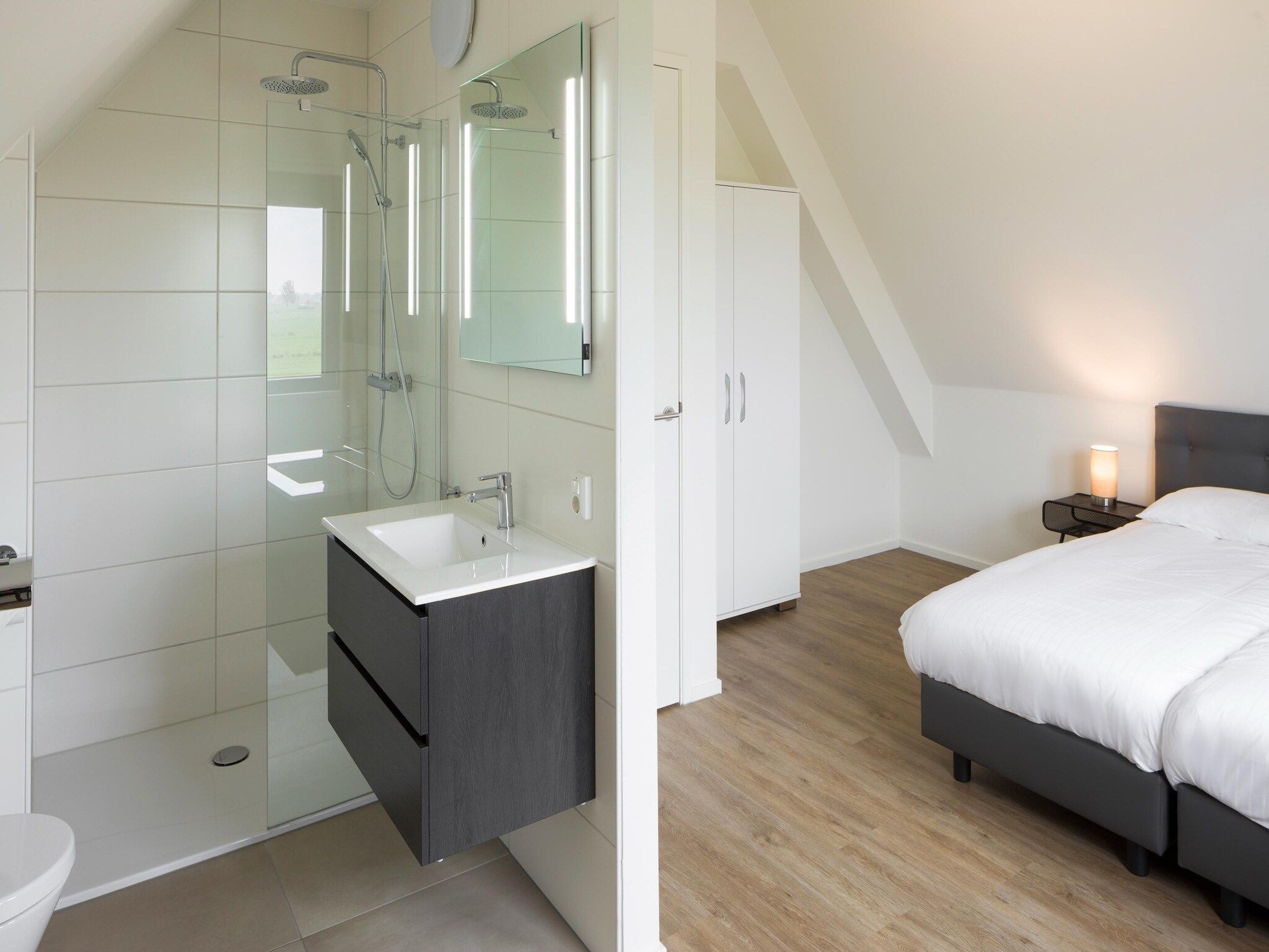 Een slaapkamer van Waterstaete Ossenzijl 1 in Ossenzijl