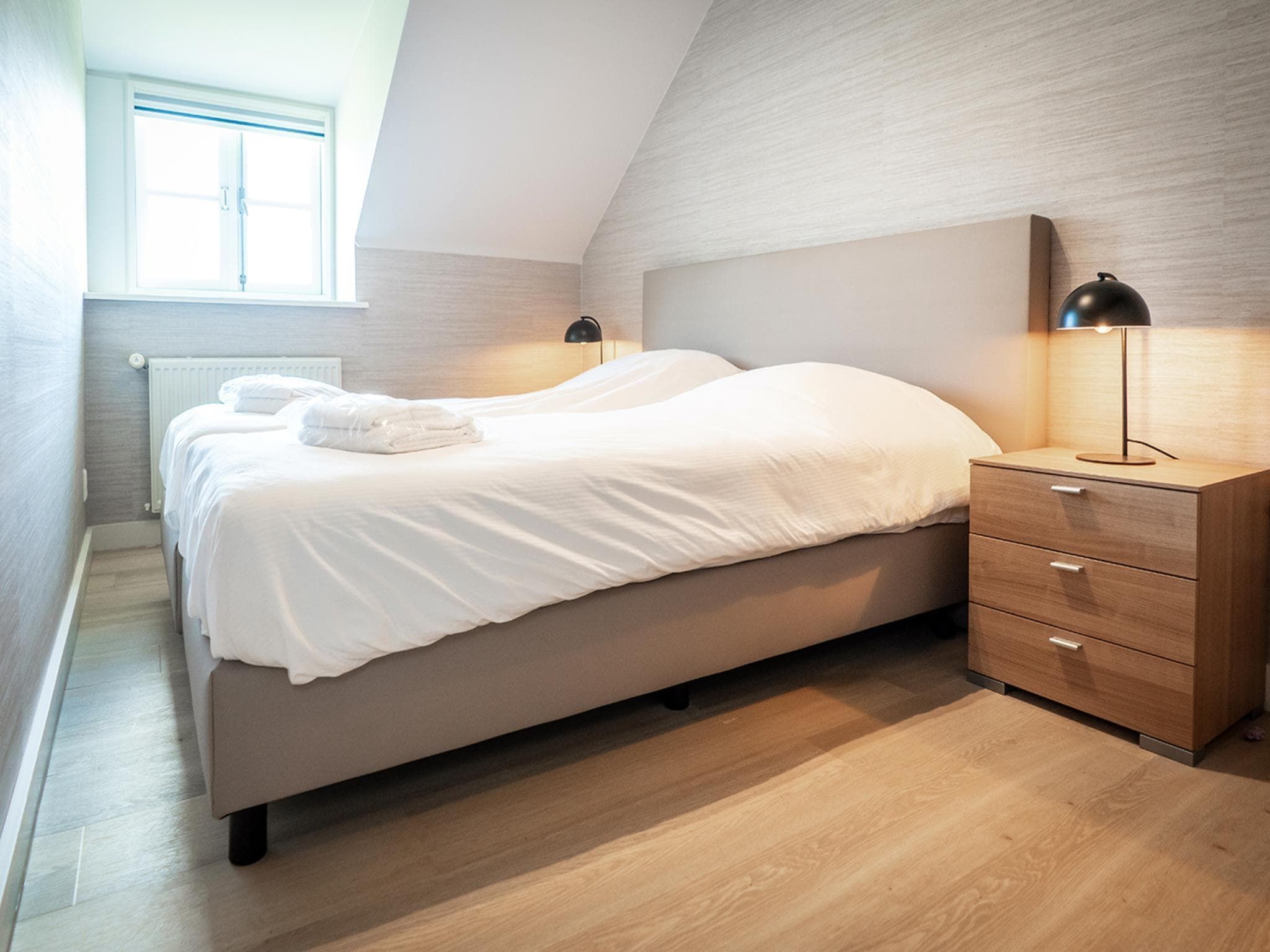 Een slaapkamer van App Hoeve Holland W6 in De Cocksdorp Texel