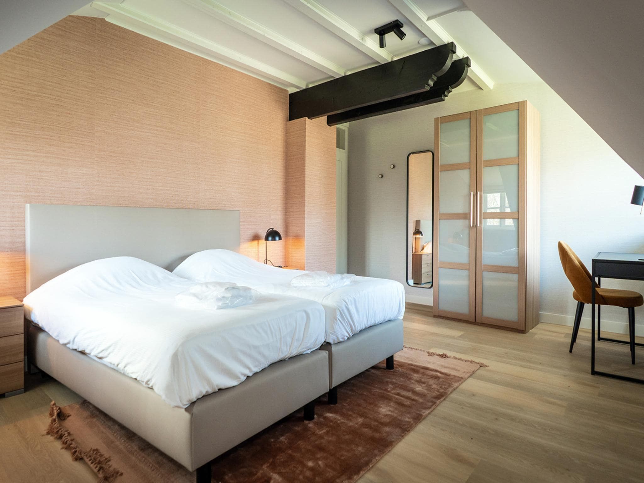 Een slaapkamer van App Hoeve Holland W6 in De Cocksdorp Texel